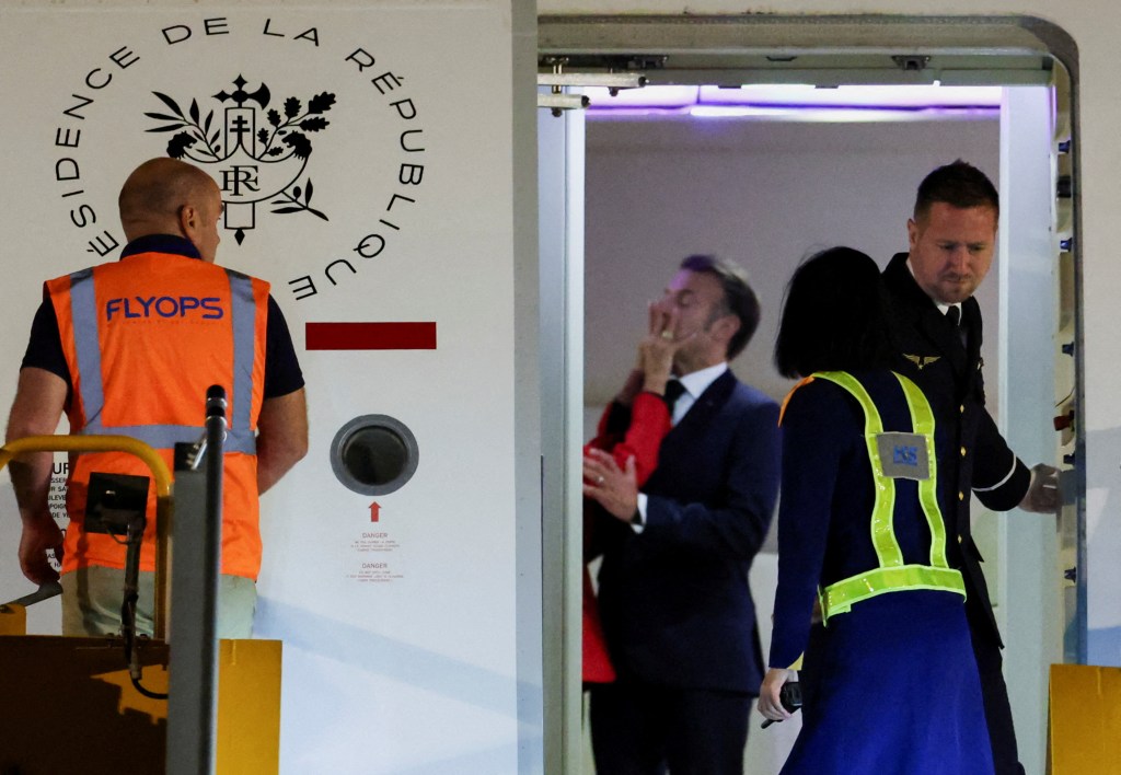 Emmanuel Macron and Brigitte Macron on airplane in Hanoi, Vietnam Sunday. 