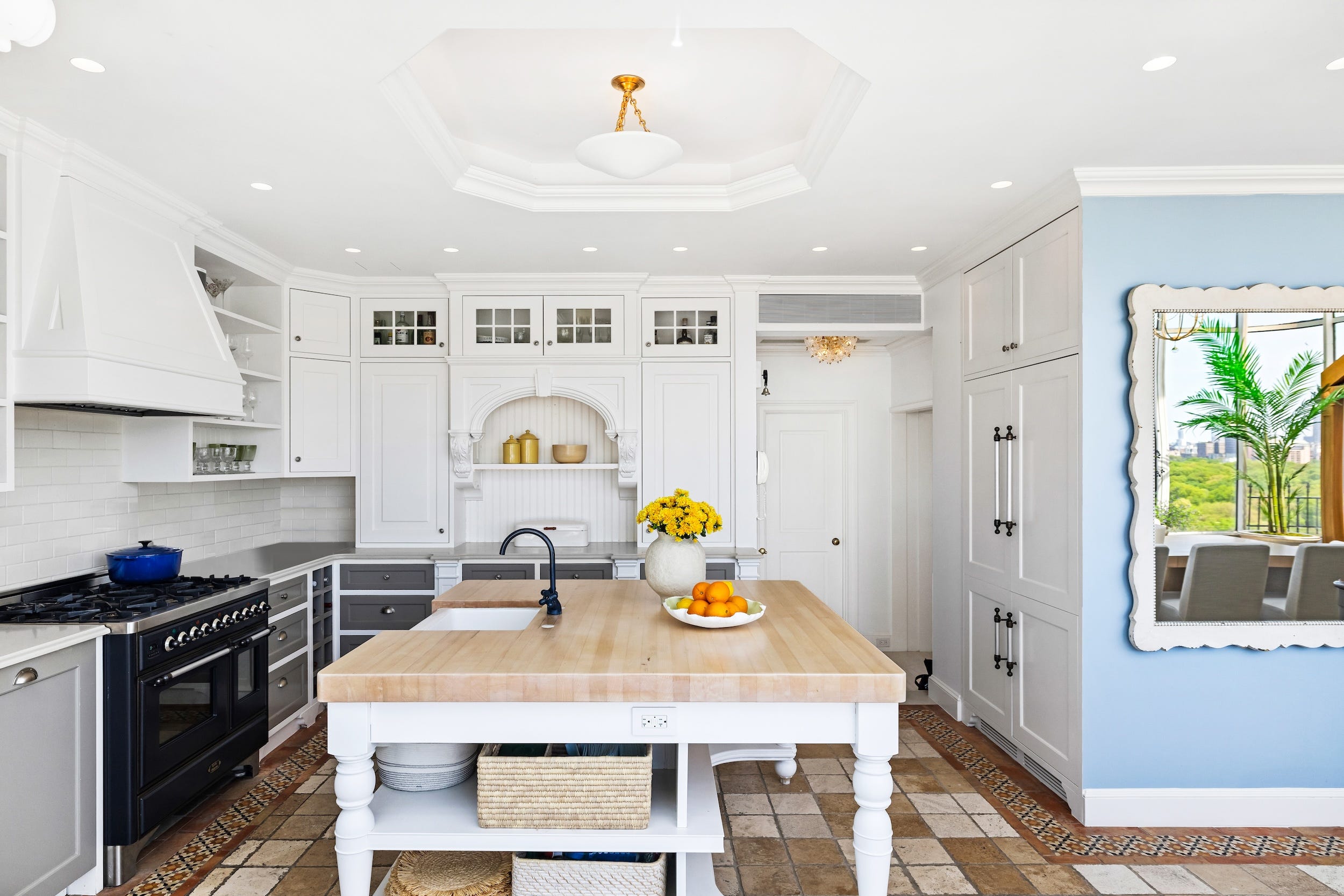 A kitchen inside a penthouse.