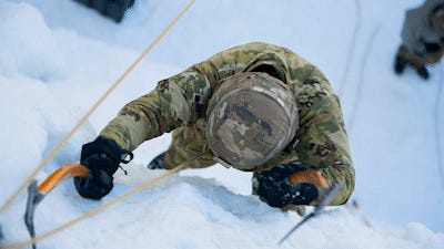 soldier on a cliff face