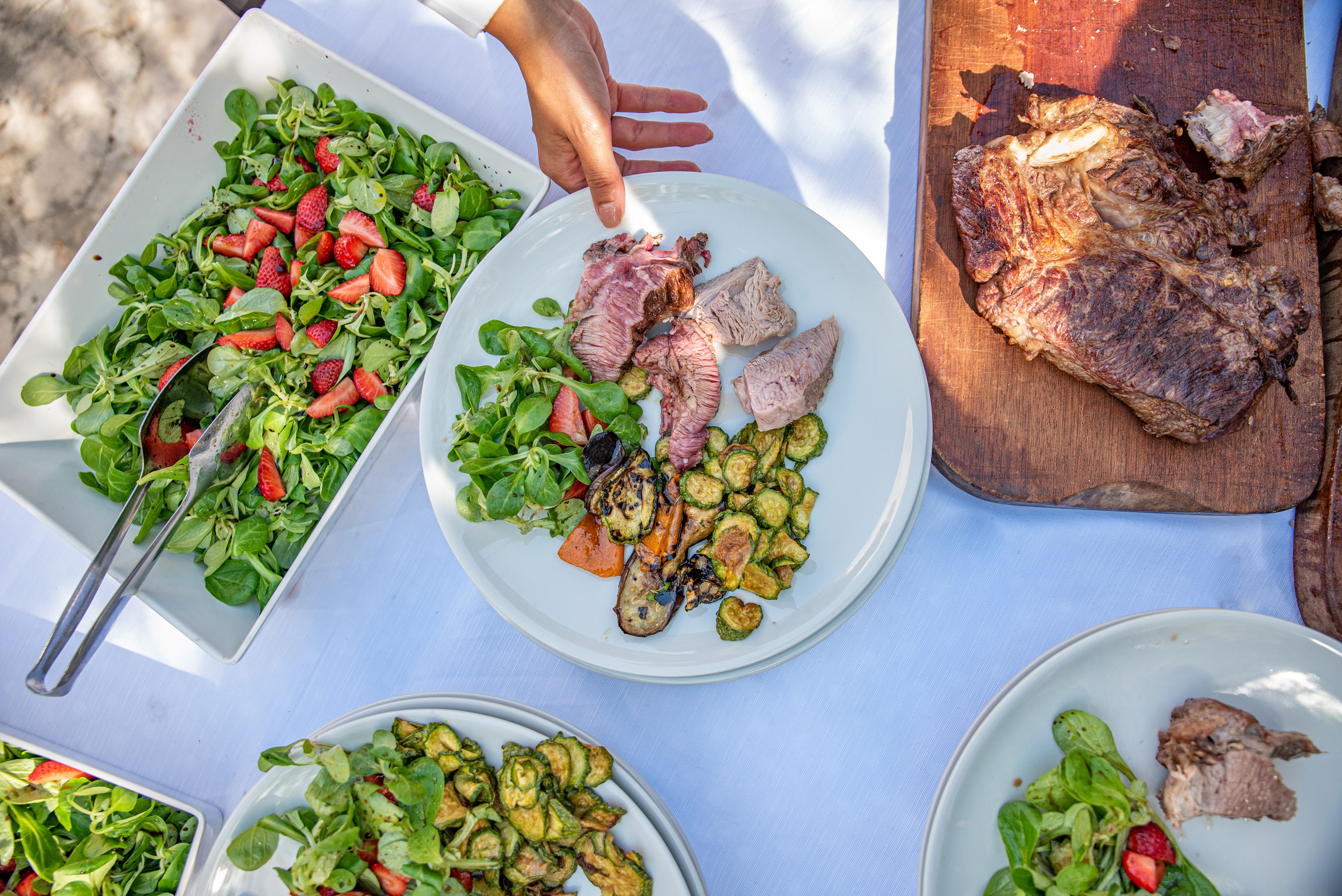table with meat, salad, vegetables