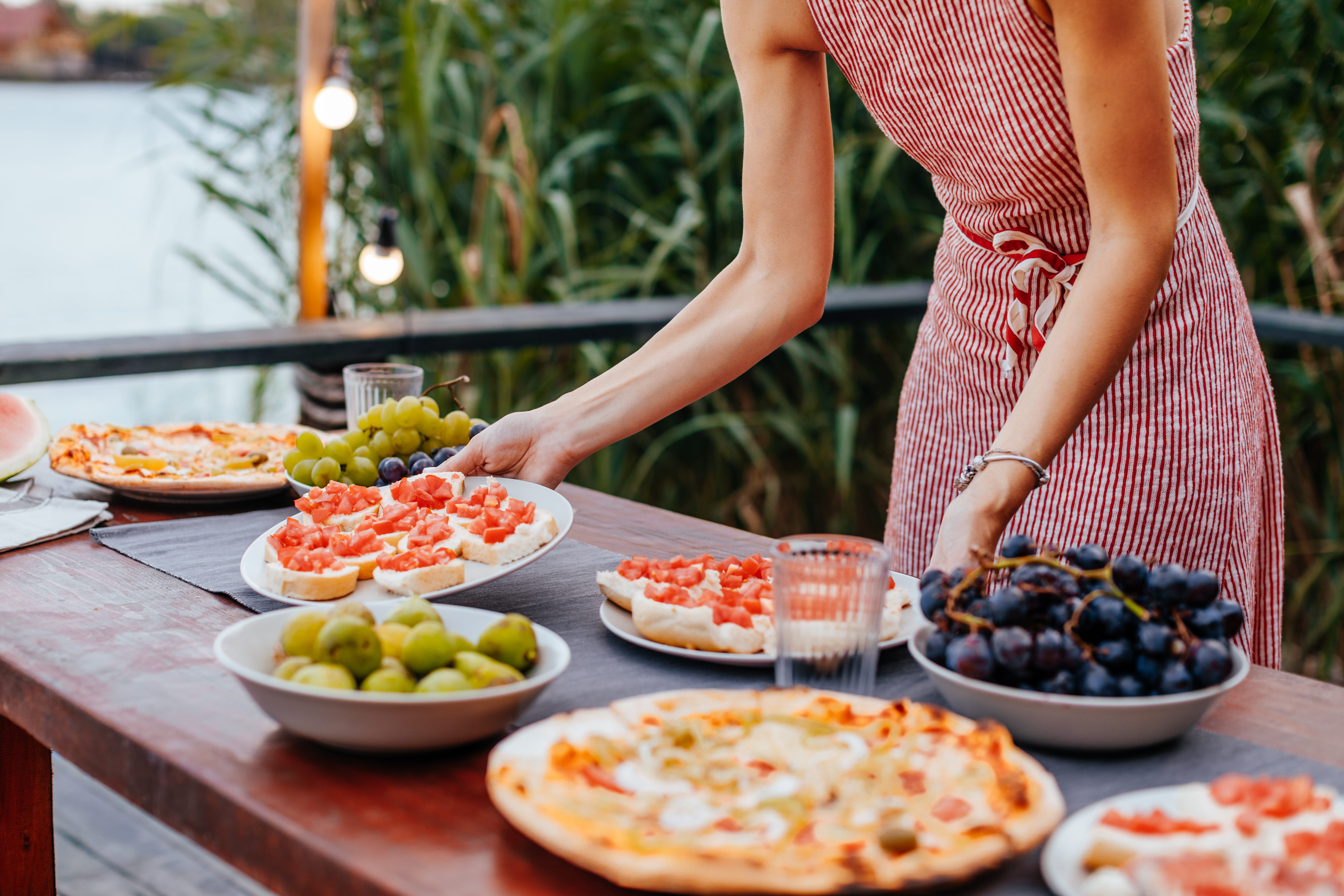Woman setting appetizers out