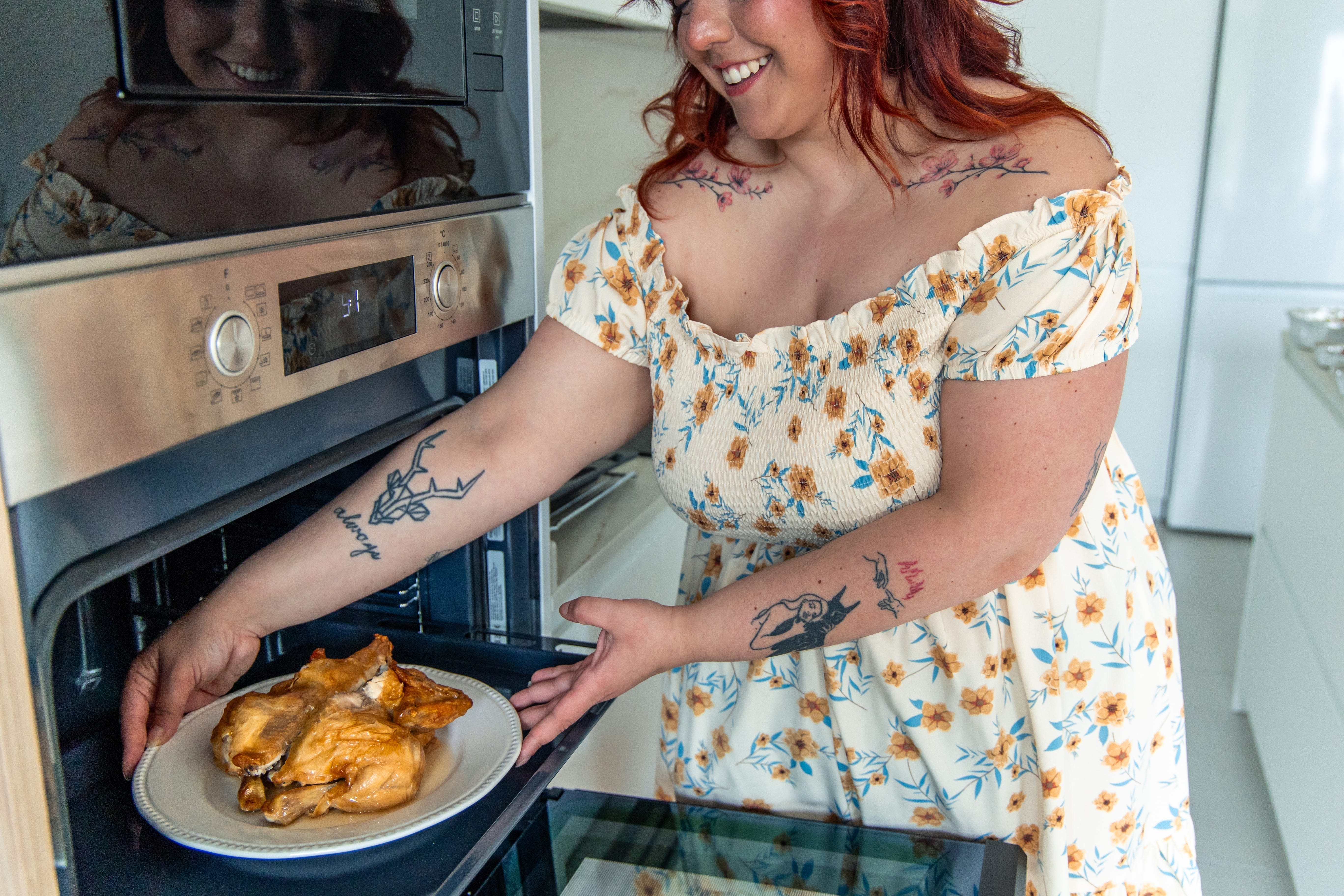 woman heating food in oven