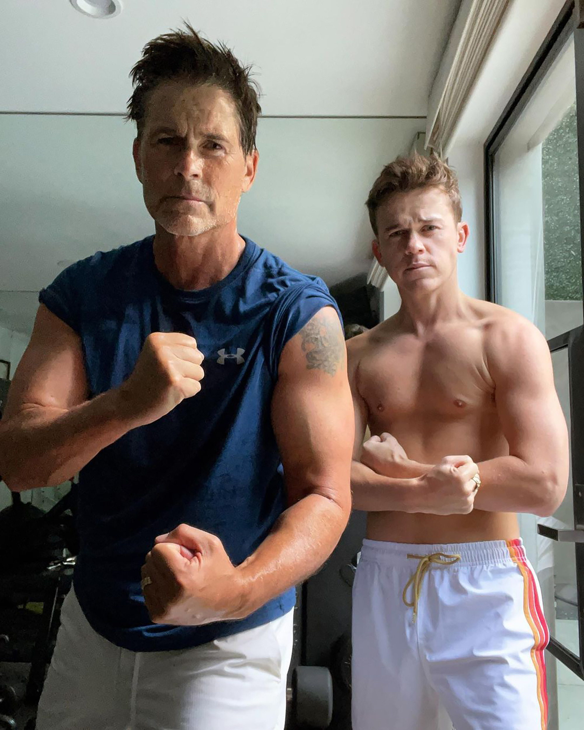 Rob Lowe and John Lowe working out