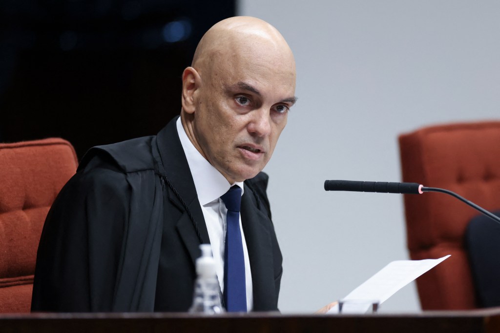 Handout picture released by Brazilian Supreme Court shows Brazilian Supreme Court Justice Alexandre de Moraes during a session of the Supreme Court as it decides if former President Jair Bolsonaro will face trial in Brasilia on March 26, 2025. Brazil's Supreme Court on March 26, 2025, ordered far-right ex-president Jair Bolsonaro to stand trial on charges of plotting a coup after failing to win re-election in 2022. (Photo by Antonio AUGUSTO / Brazilian Supreme Court / AFP) / RESTRICTED TO EDITORIAL USE - MANDATORY CREDIT 