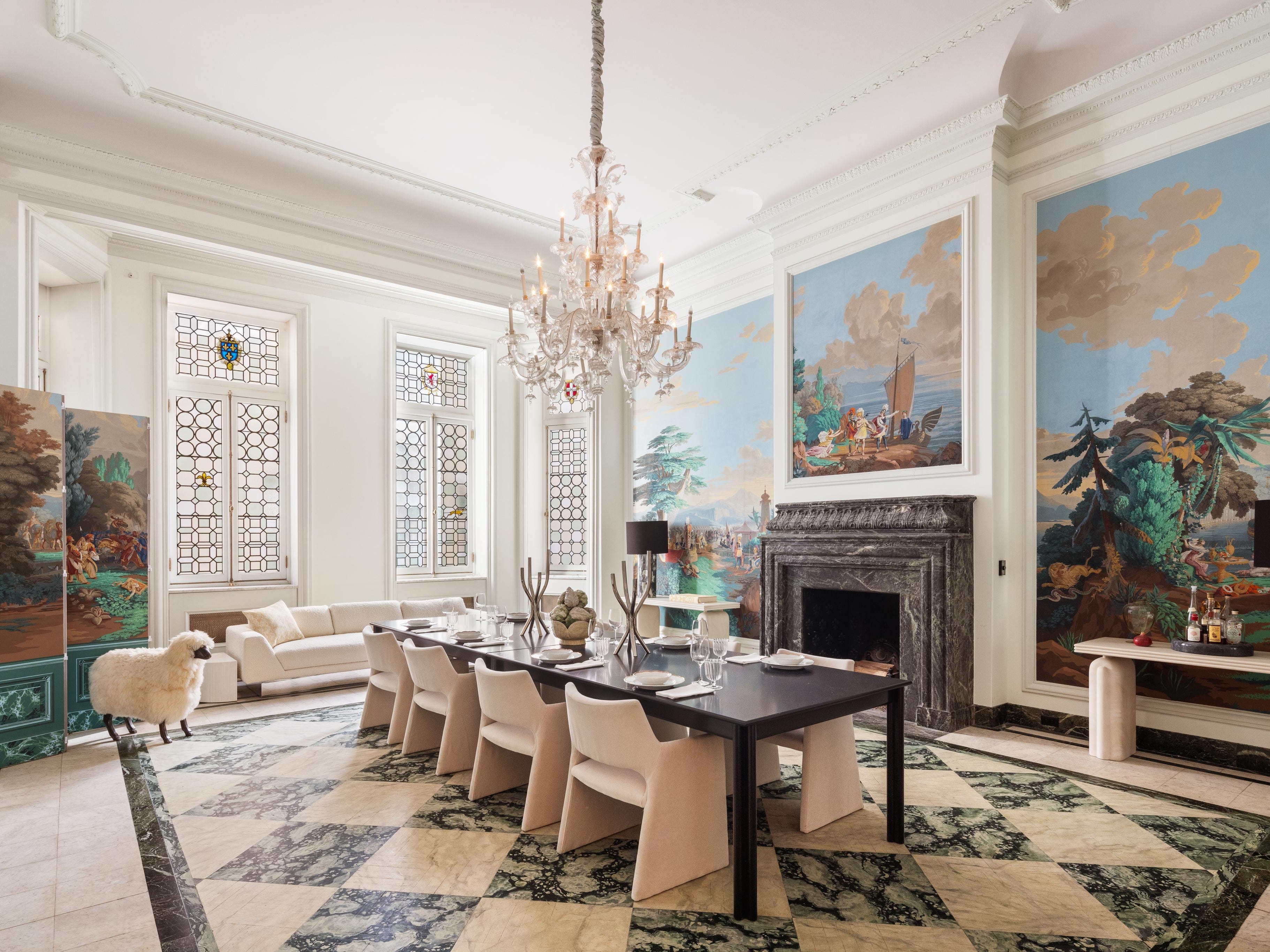 the dining room with illustrated wallpaper full dining table and checkered flooring