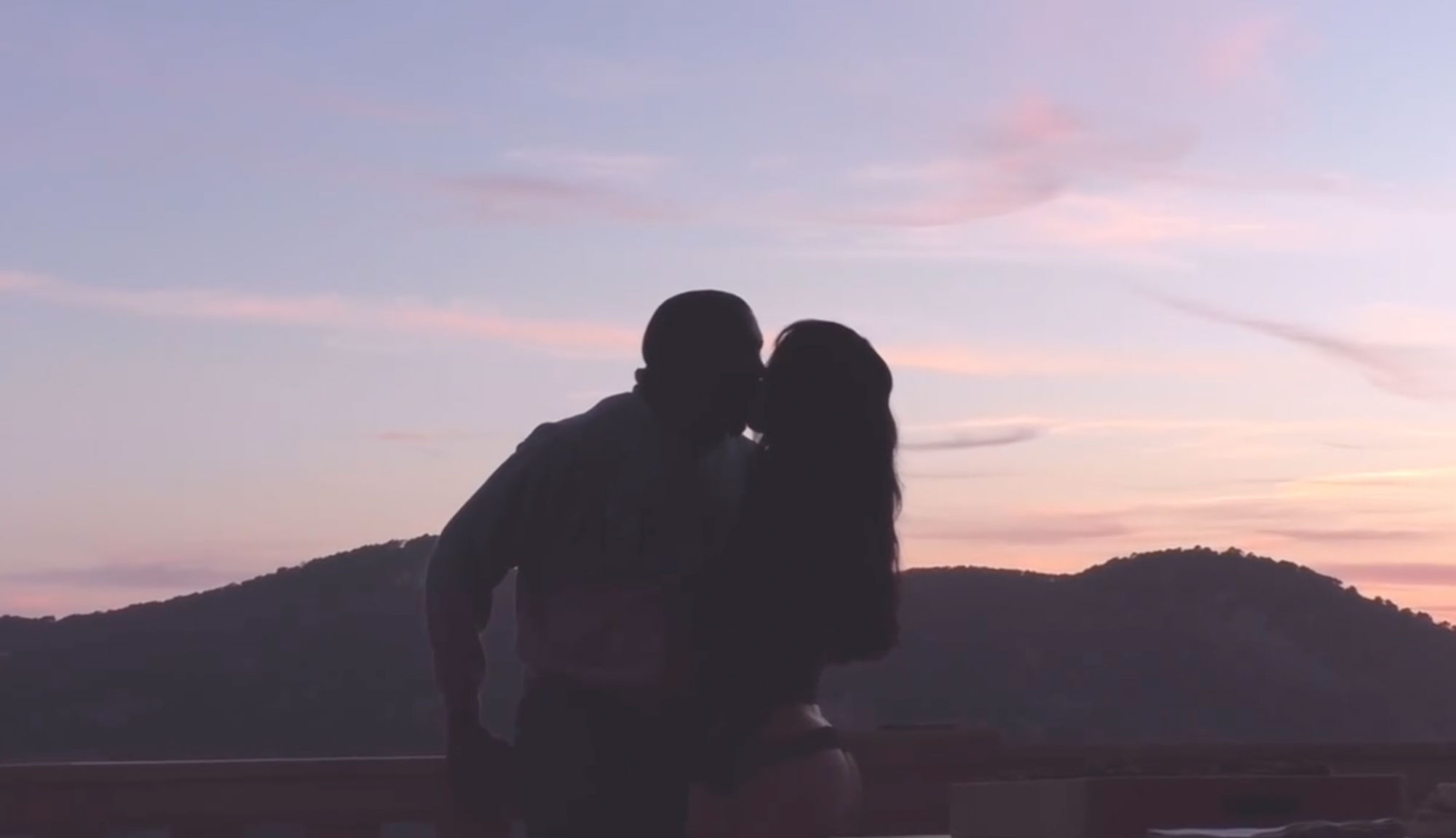 Bianca Censori and Kanye West kiss. 