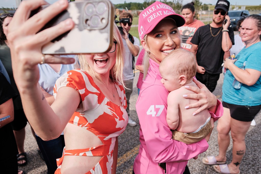 Savannah takes a photo with fans.