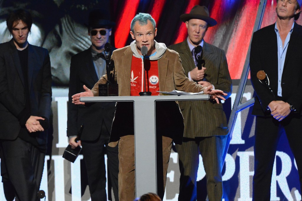 7 (L-R) Inductees Cliff Martinez, Anthony Kiedis, Jack Irons, Chad Smith, Michael Balzary aka Flea, and Josh Klinghoffer of Red Hot Chili Peppers accept their award on stage during the 27th Annual Rock And Roll Hall Of Fame Induction Ceremony at Public Hall on April 14, 2012 in Cleveland, Ohio.