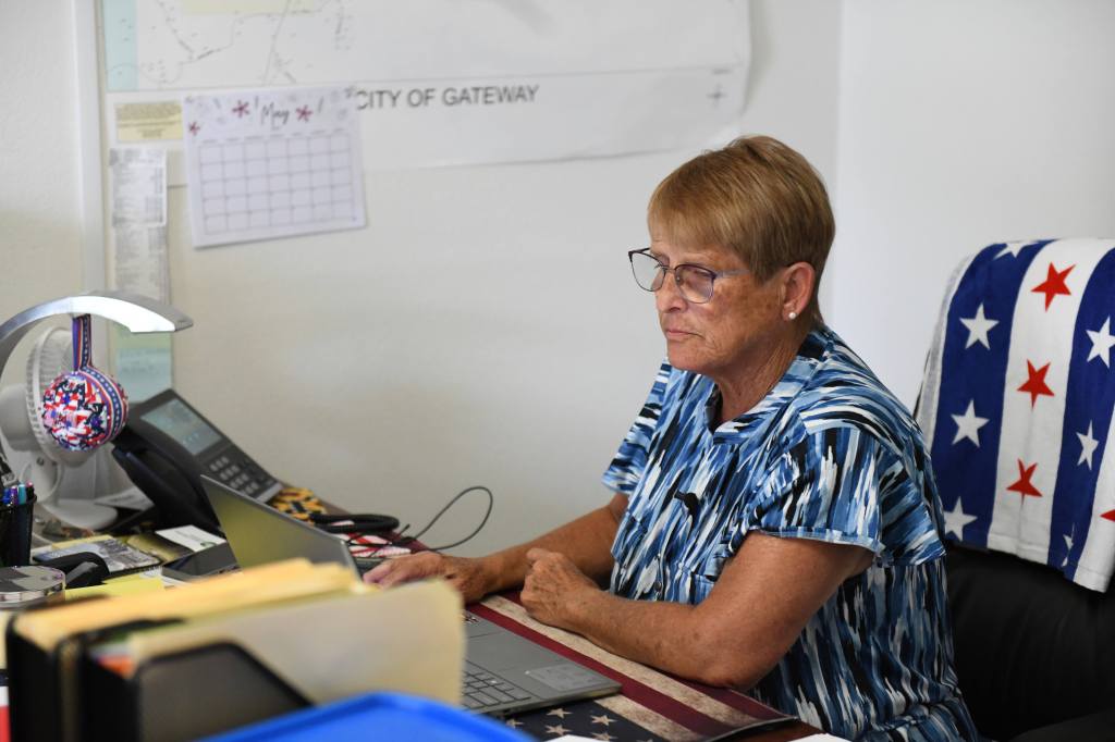 Cheryl Tillman, mayor of Gateway, Ark., and sister of James Appleton, who was fatally shot in 2017, works on her laptop at Town Hall on May 28, 2026.