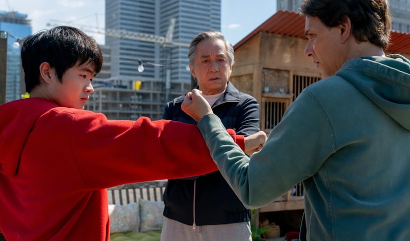 Jackie Chan, center, Ralph Macchio, right, and Ben Wang in Karate Kid: Legends