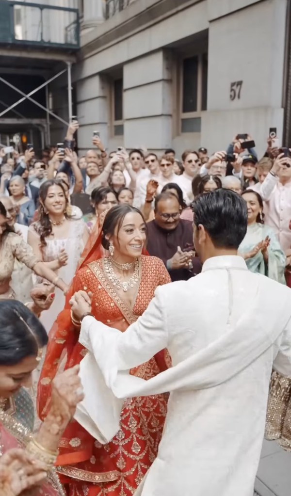 An exciting 400-member Baraat procession during an Indian wedding, shutting down Wall Street, with groom Varun Navani, bride Amada Soll and various celebrities in attendance.