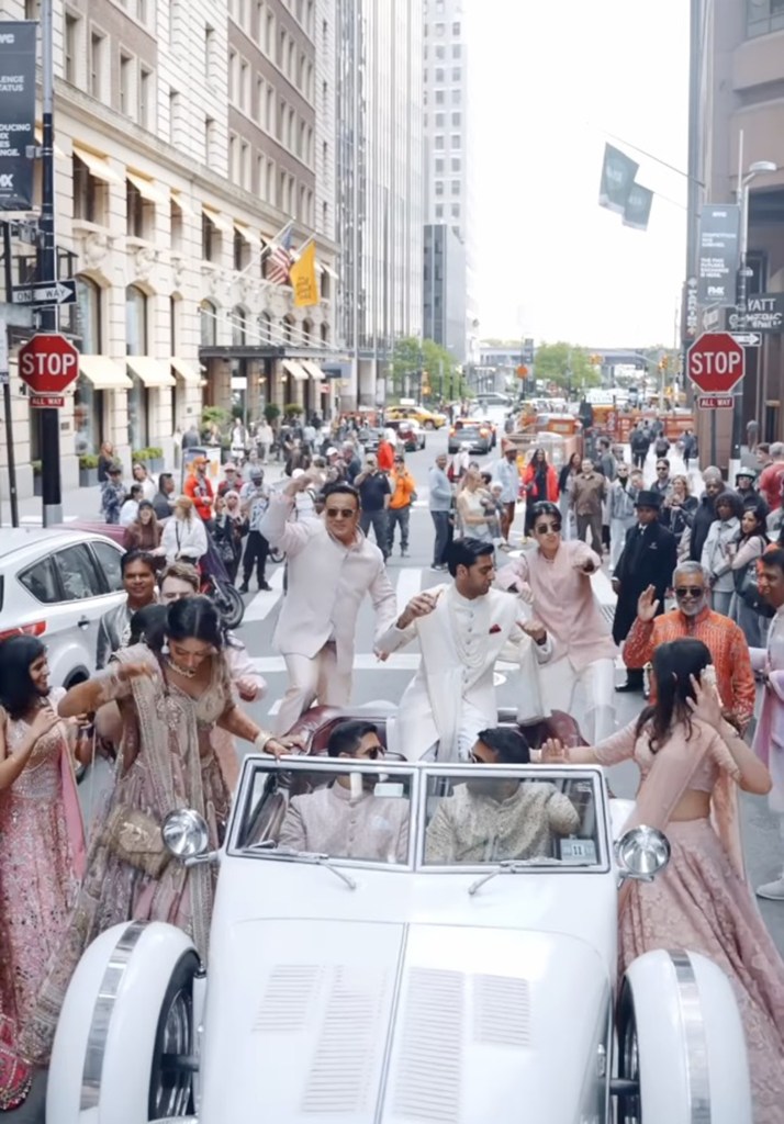 The groom was also seen riding in a white vehicle down the street.
