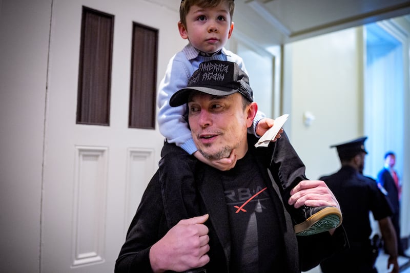 Elon Musk and his son X Æ arrive for a meeting with Senate Committee on Commerce, Science, and Transportation members at the U.S. Capitol Building on May 21, 2025 in Washington, DC.