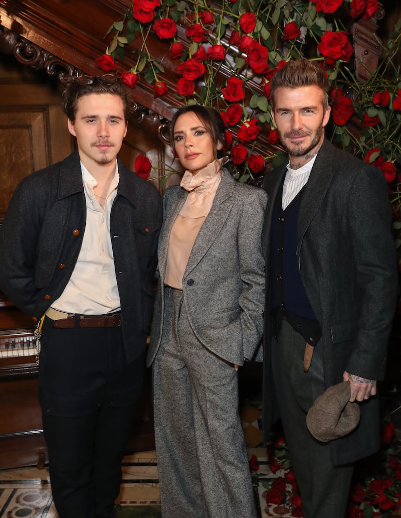 (L-R) Brooklyn, Victoria and David Beckham