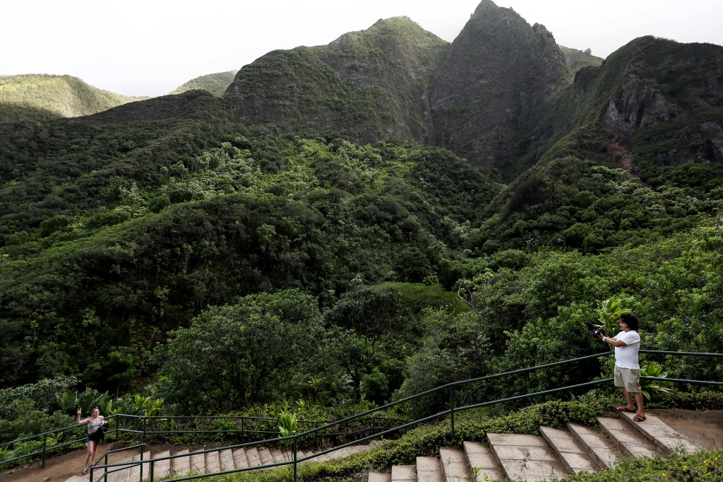 People visiting Iao Valley State Monument, an important historic site and tourist attraction, in Wailuku, Hawaii