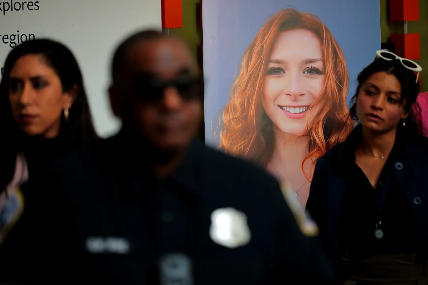 Guests gather near a photograph of Sarah Lynn Milgrim during a remembrance and reopening ceremony at the Lillian and Albert Small Capital Jewish Museum in Washington, D.C., on May 29. The museum reopened one week after two Israeli Embassy staff members, Milgrim, 26, and Yaron Lischinsky, 30, were shot dead as they left an event at the museum.