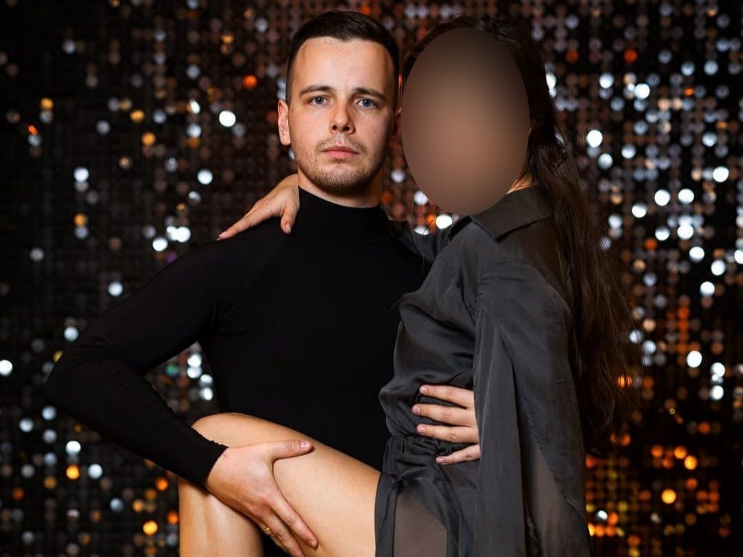 Serhii Nazarenko poses with a dancing partner.