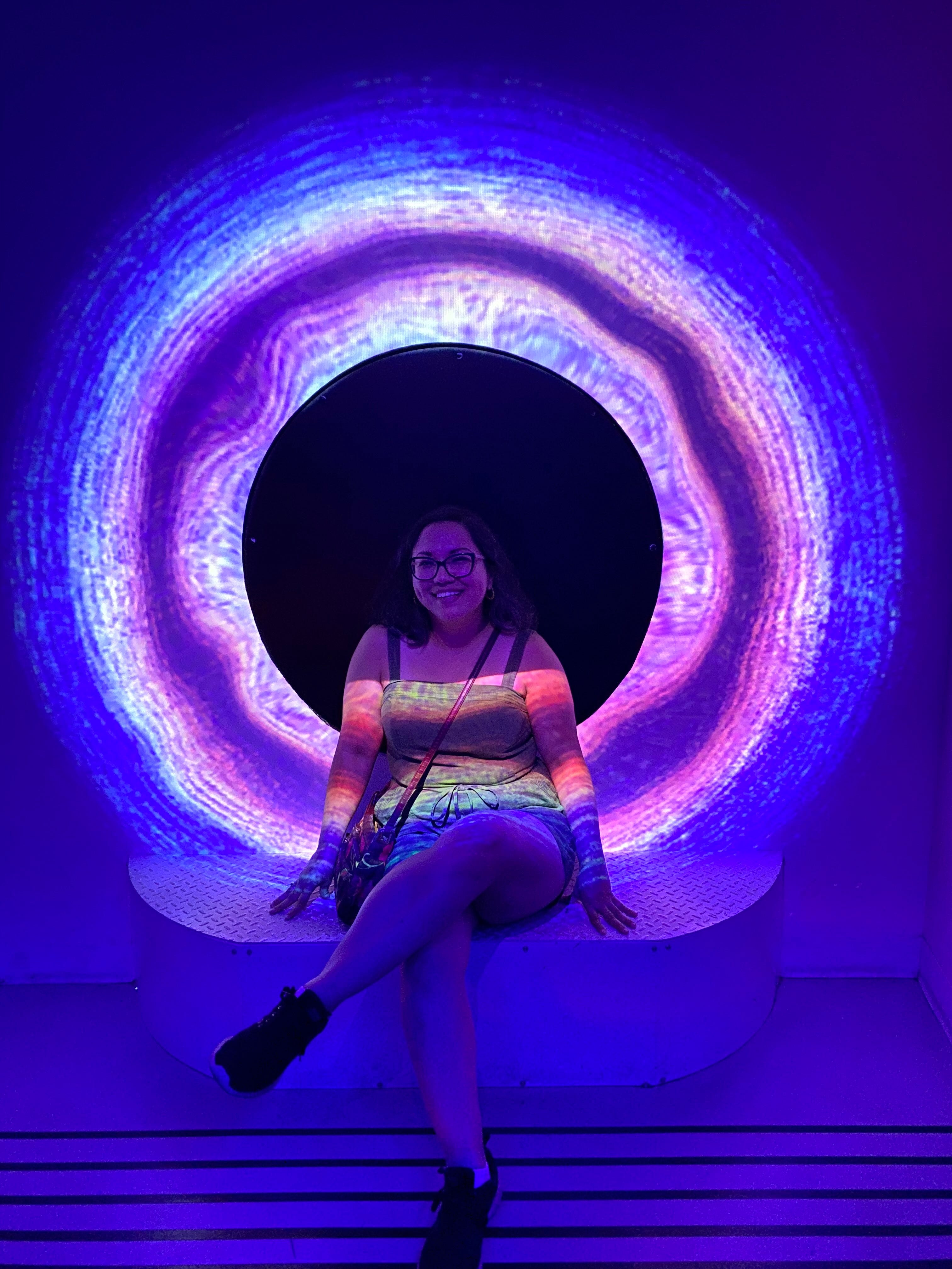 Woman posing at Meow Wolf's Omega Mart in Las Vegas.