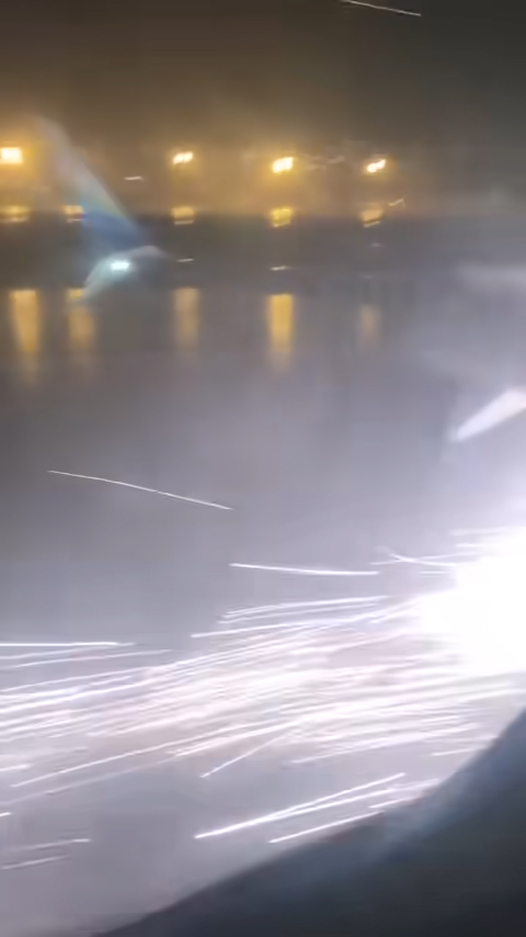 A passenger aboard the flight captured the moment the plane sparked during the landing.