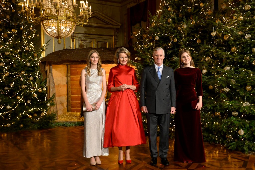King Philippe, Queen Mathilde and their daughters, Princess Eleonore and heir to the throne, Princess Elisabeth, posing in front of a Christmas tree at a concert in Brussels, Belgium on December 18, 2024.