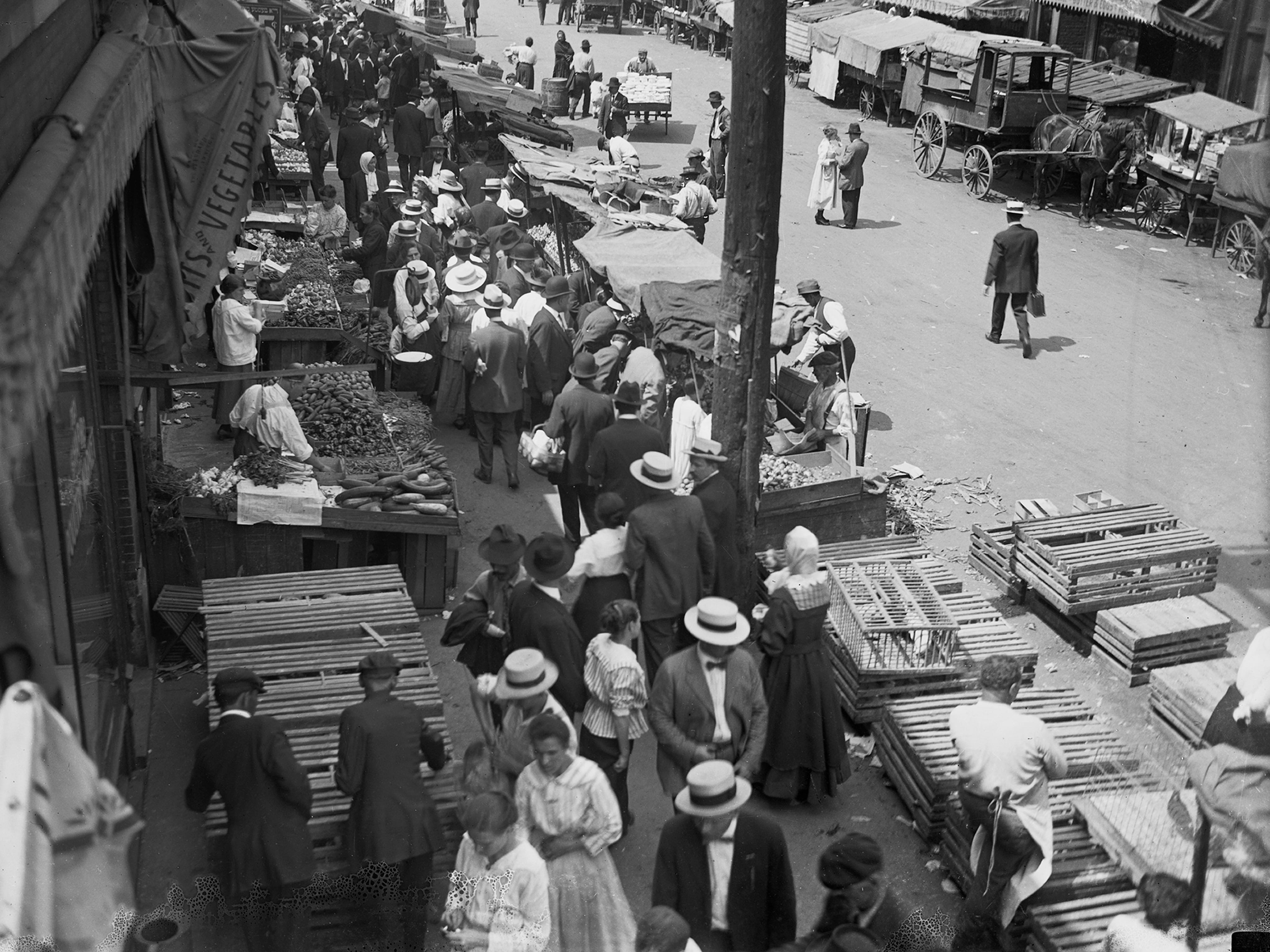 People gather at stalls in city market