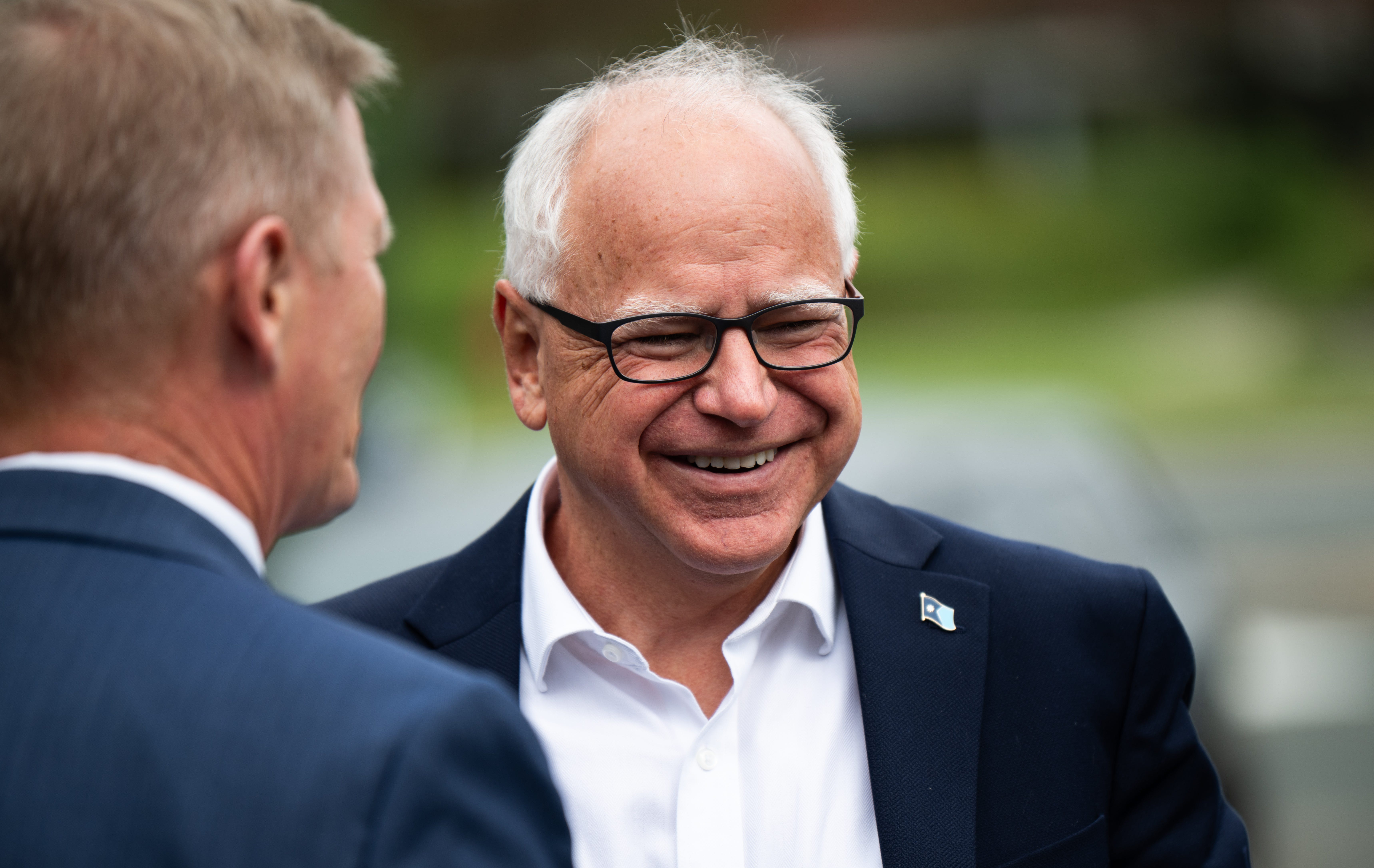 Tim Walz smiling.