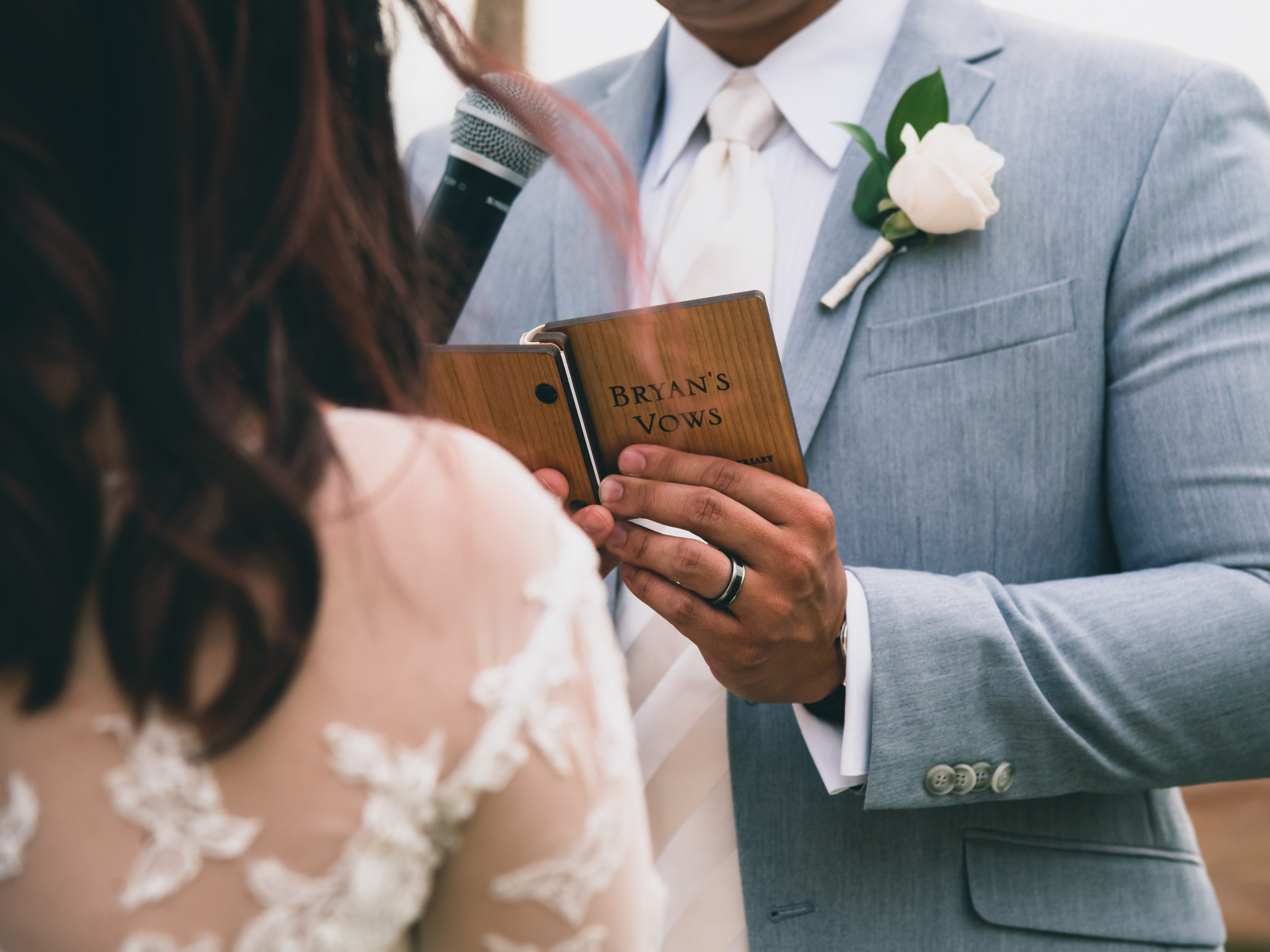 Groom reads wedding vows to bride