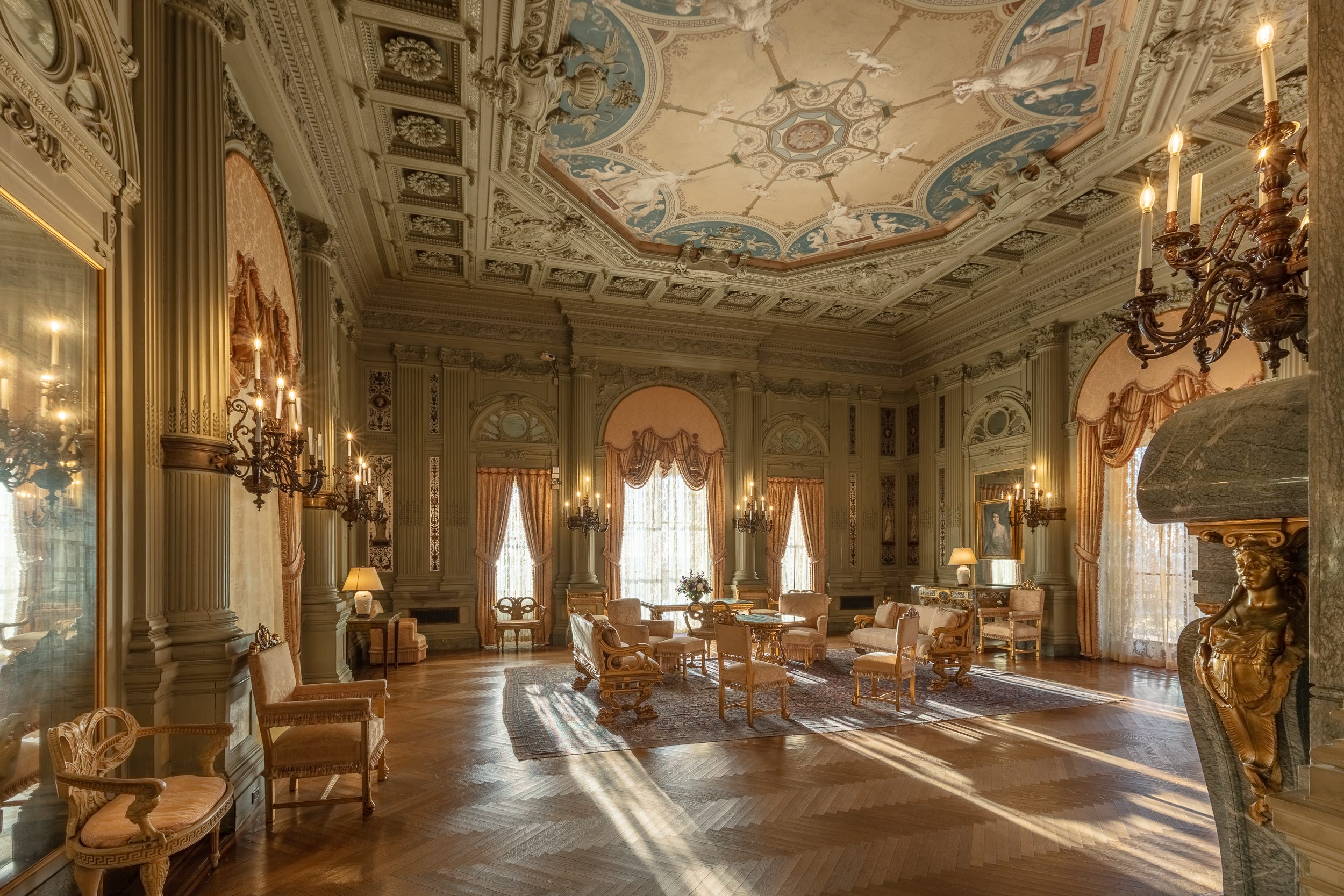 The Morning Room at The Breakers. A Gilded Age room with green walls and an ornate ceiling.
