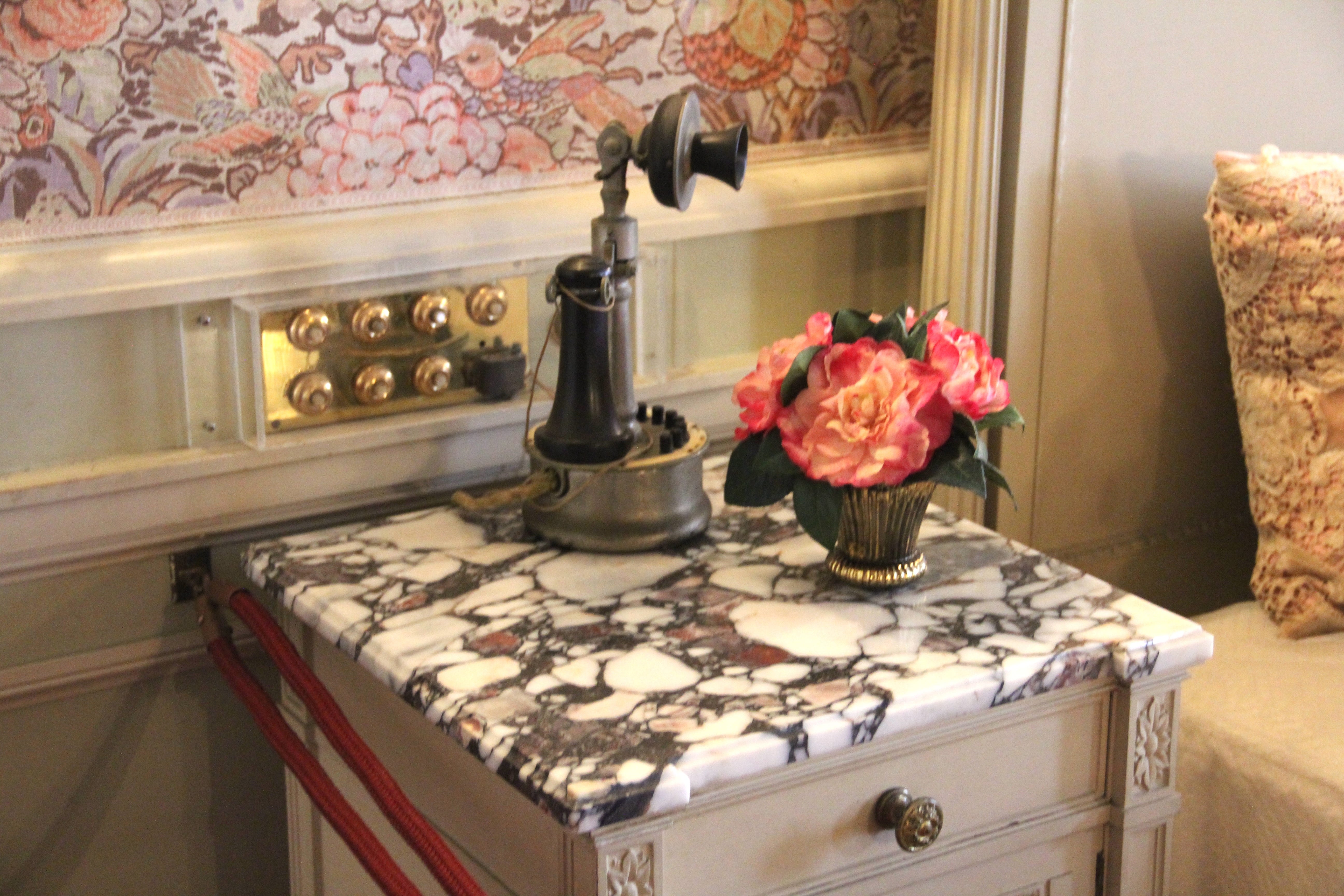 A telephone next to Alice Vanderbilt's bed.
