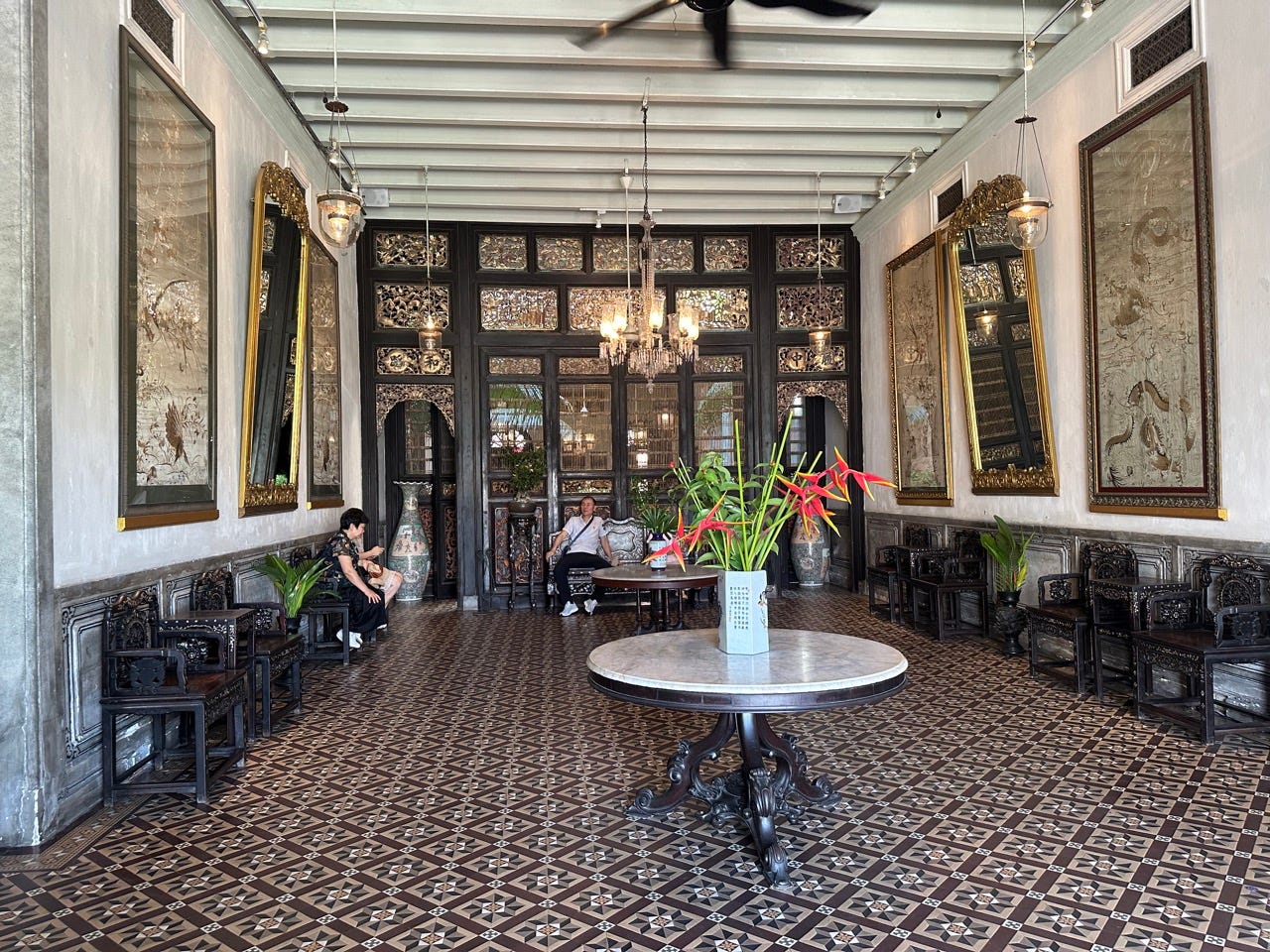 Patterned floor, white marble table in room