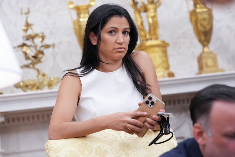 White House Deputy Chief of Staff Stephen Miller's wife Katie Miller listens as President Donald Trump and Elon Musk speak to reporters in the Oval Office of the White House on May 30, 2025 as he departs his official tine as a White House adviser.