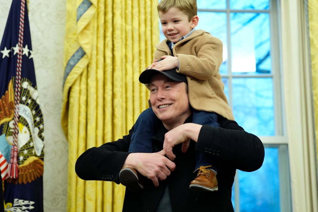 Elon Musk with his son in February. 