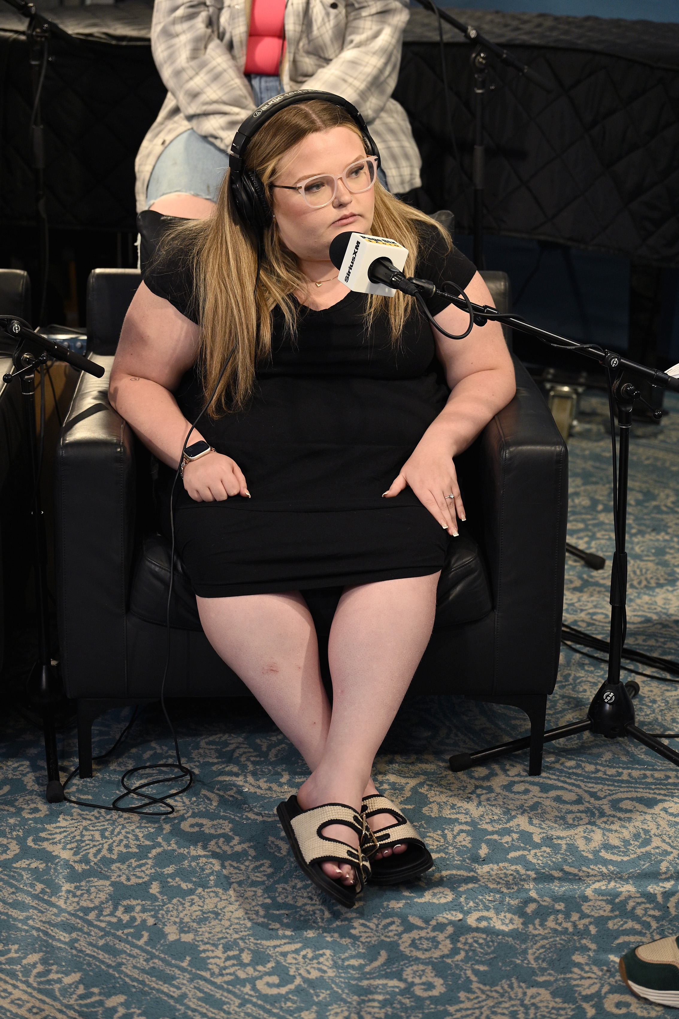 Honey Boo Boo speaks into a microphone. 