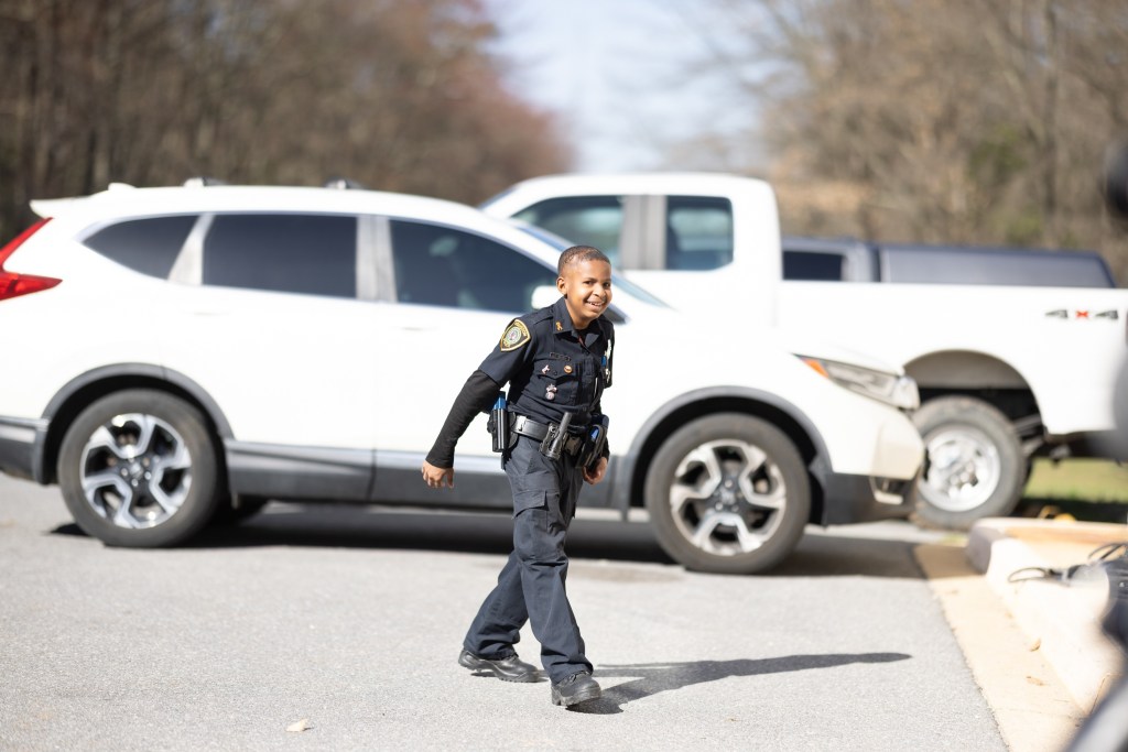 Daniel in a police uniform. The boy dreams of becoming a police officer.