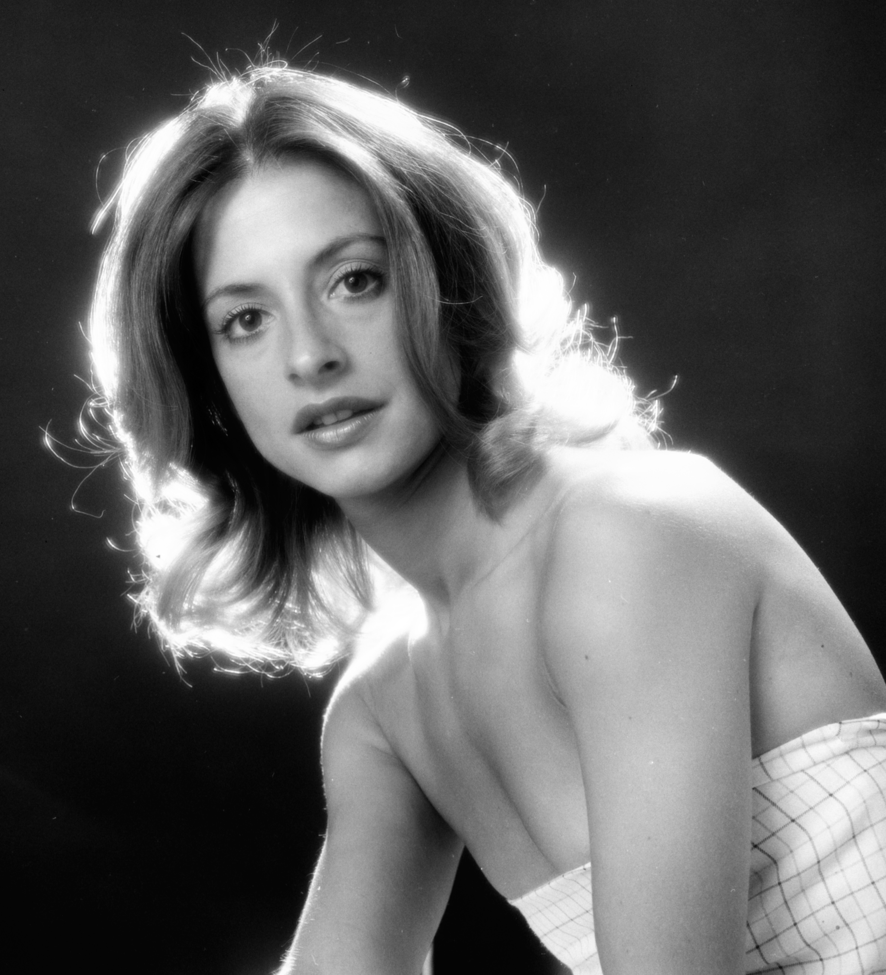 Patti LuPone in a black and white headshot. 