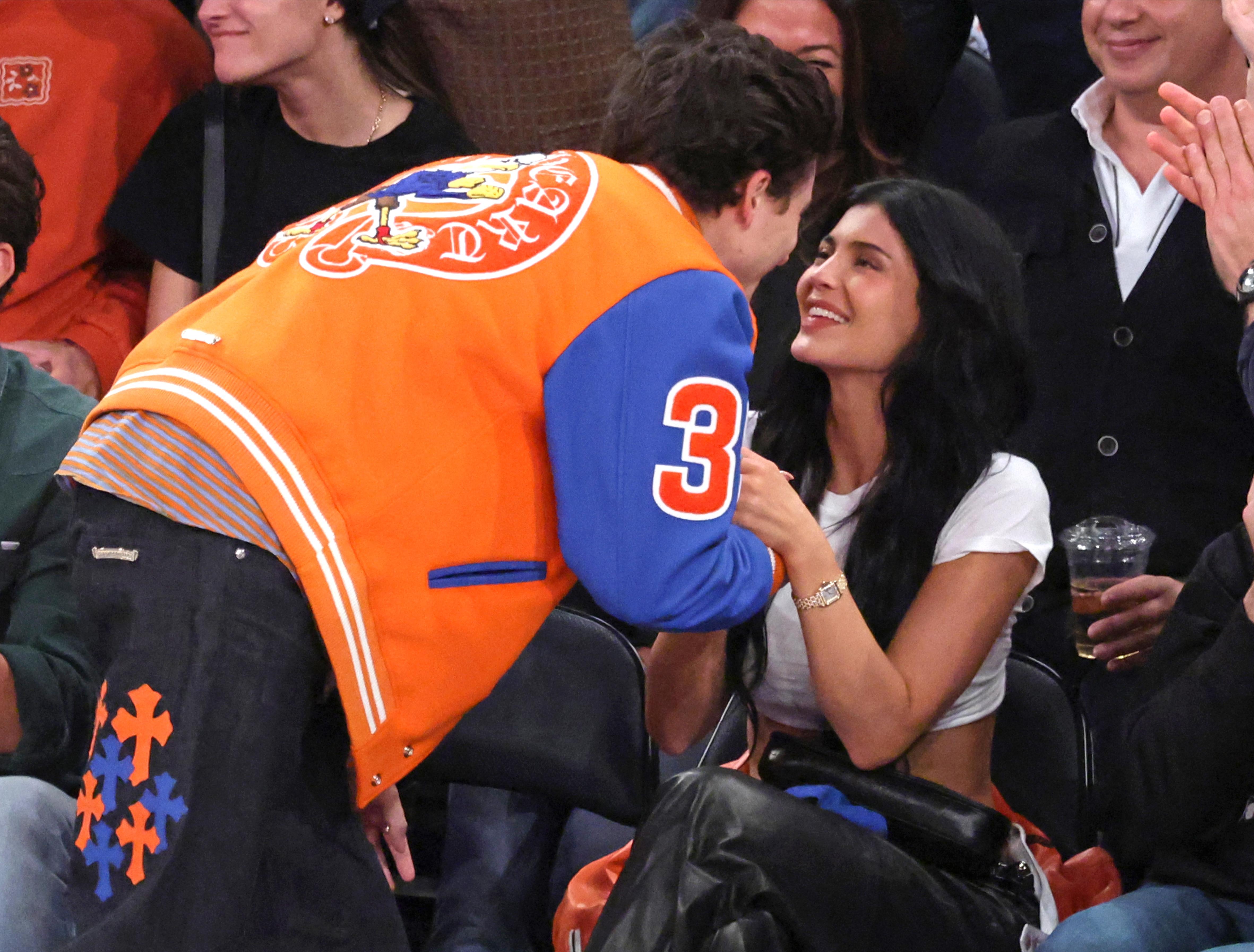 Kylie Jenner smiles up at Timothee Chalamet. 