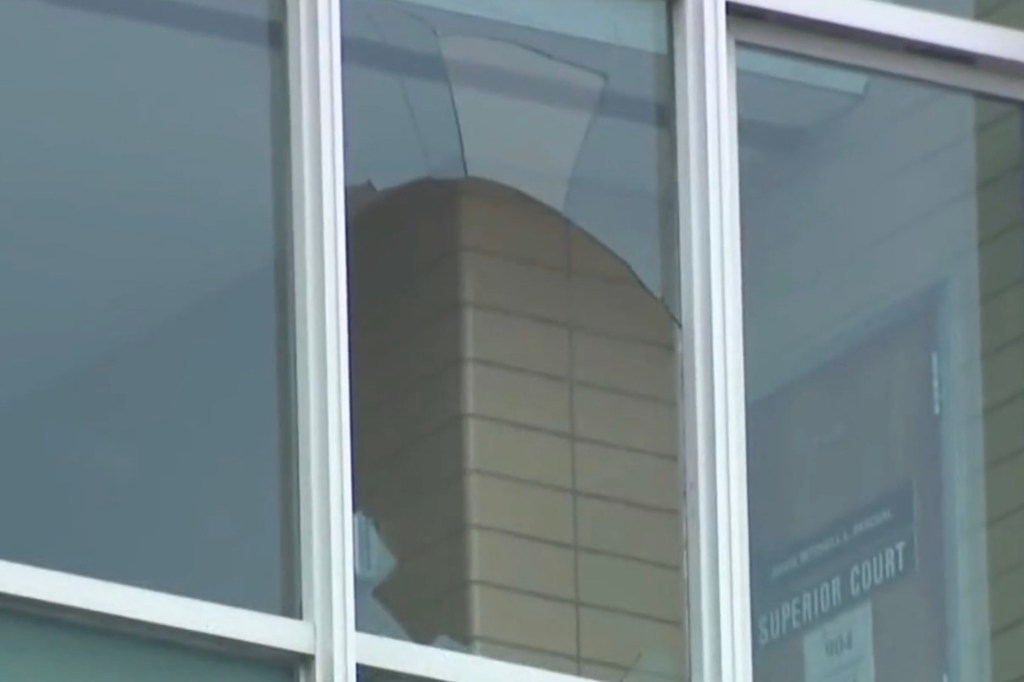 A broken window on the 9th floor of the building where Rivera fell out of.