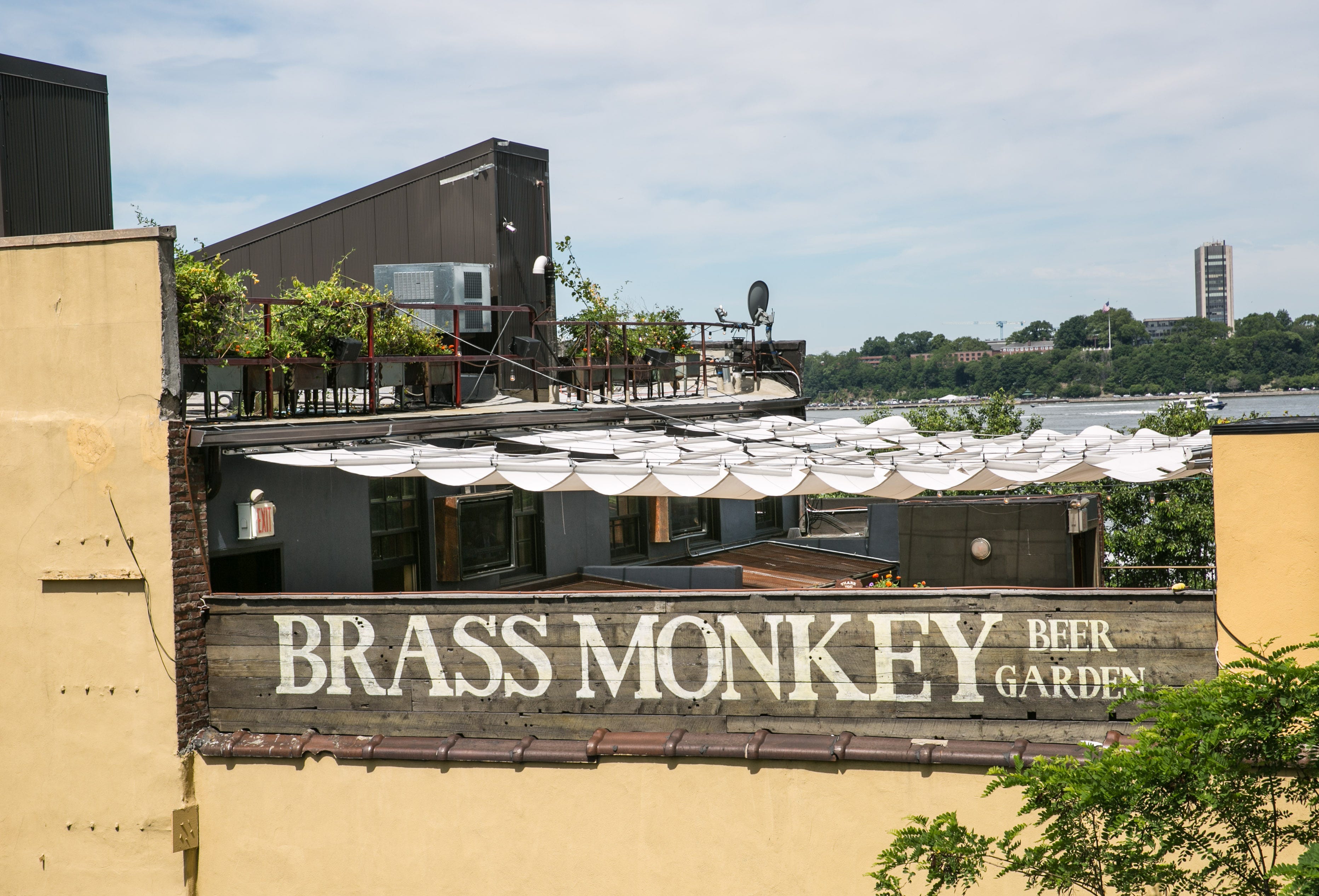 The outdoor patio of the Brass Monkey restaurant and bar is viewed from The High Line above the Meatpacking District on June 9, 2017 in New York City.