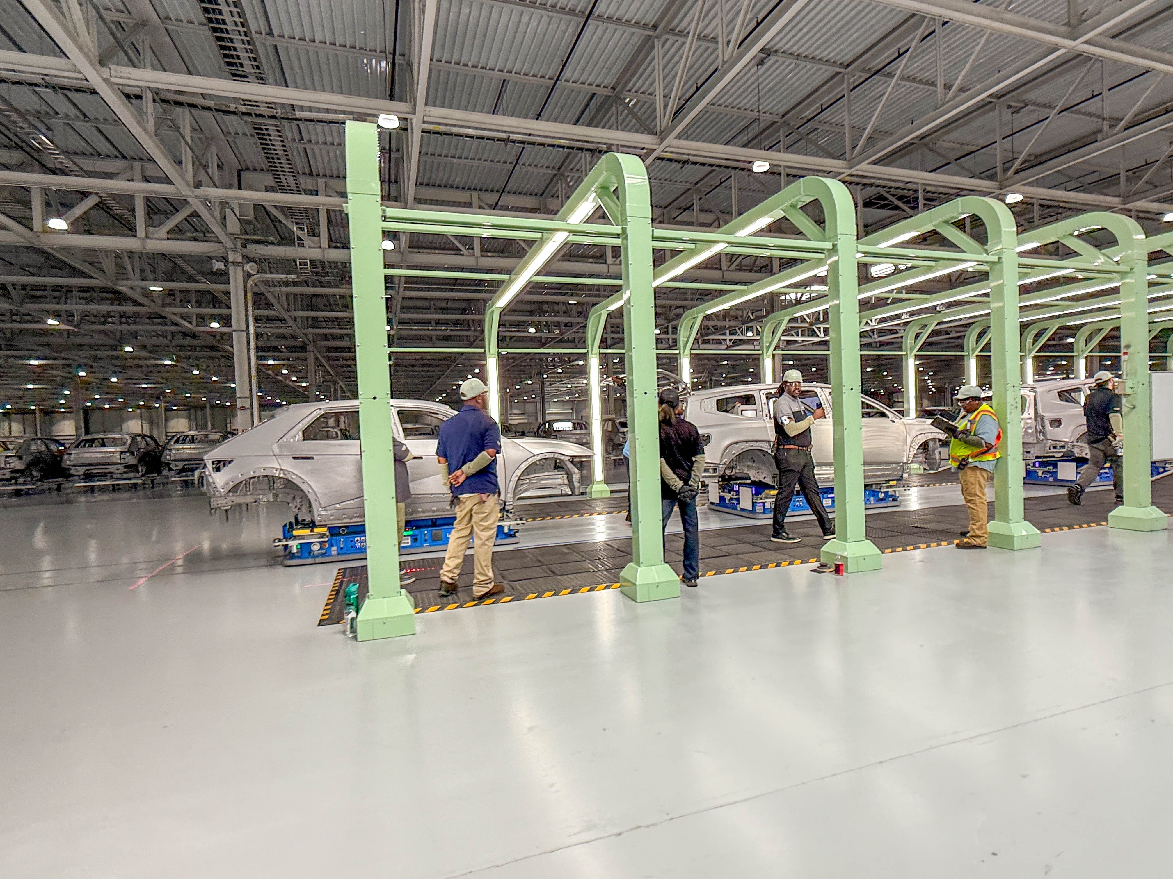 Hyundai Ioniq 5 and Ioniq 9 EVs are going through quality inspections in the welding shop at the Hyundai Motor Group Metaplant America in Georgia.