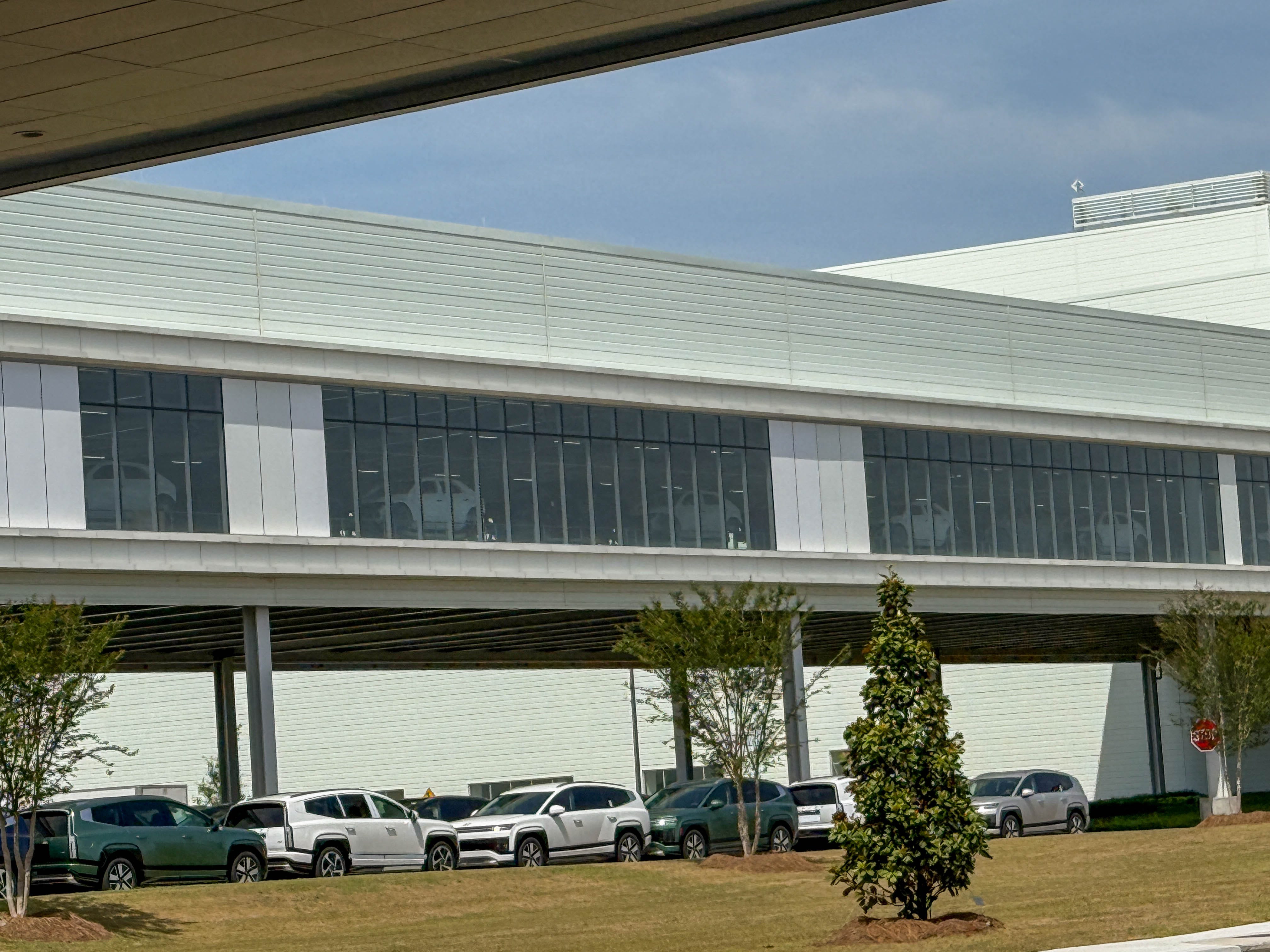 Hyundai EV bodies moving from the paint shop to the assembly facility at the Hyundai Motor Group Metaplant America in Georgia.