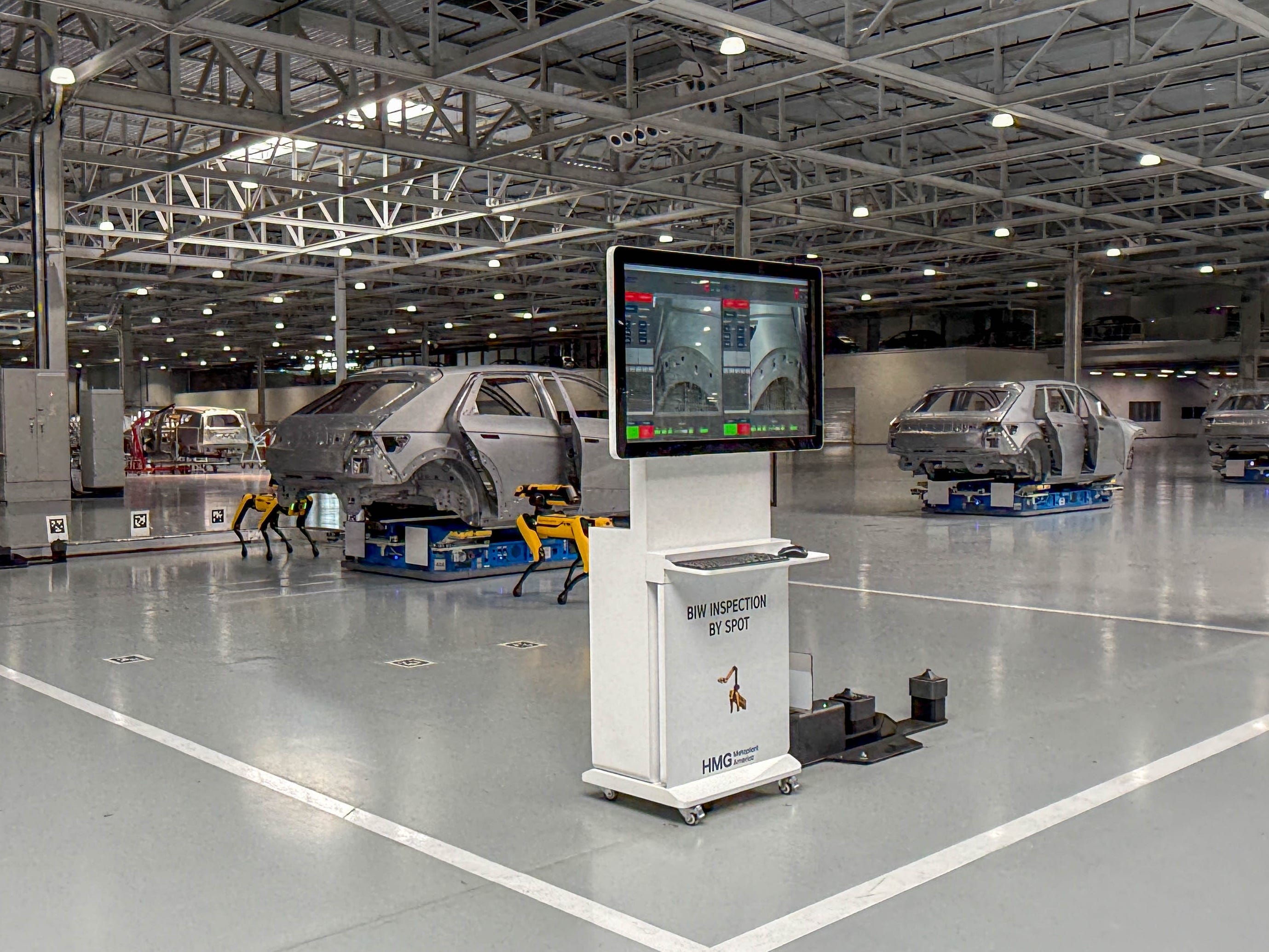 Boston Dynamics robot dogs inspecting Hyundai Ioniq 5 EVS at the Hyundai Motor Group Metaplant America in Georgia.