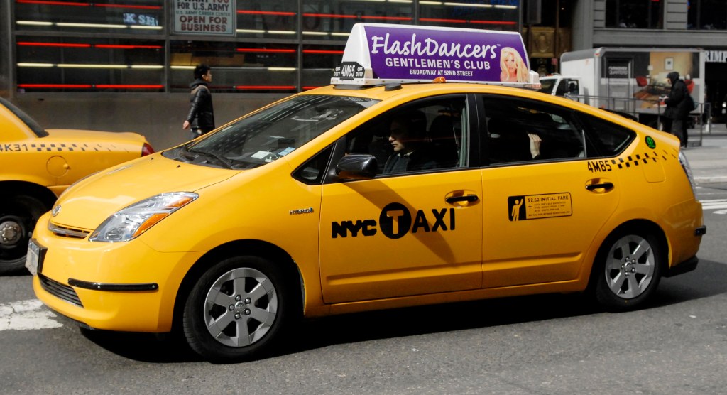 A Toyota Prius taxi cab.