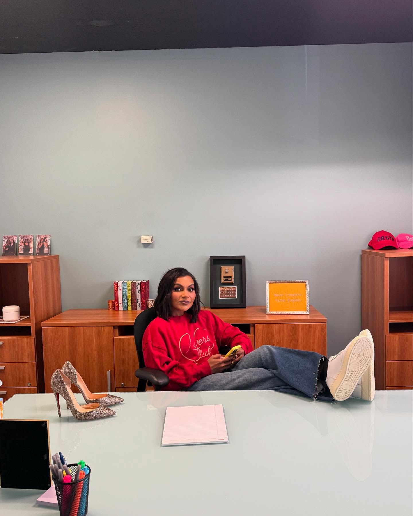 Mindy Kaling gets comfortable in her workspace before buckling down.