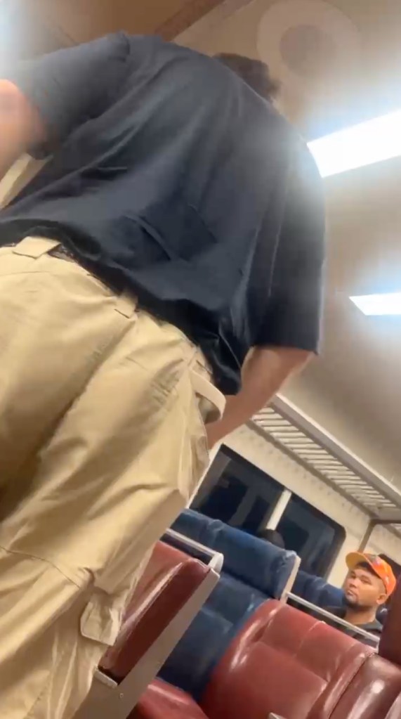 Screenshot of video taken by Kaylin Morales shows Rex Heuermann's back as he exits the LIRR train at Massapequa station