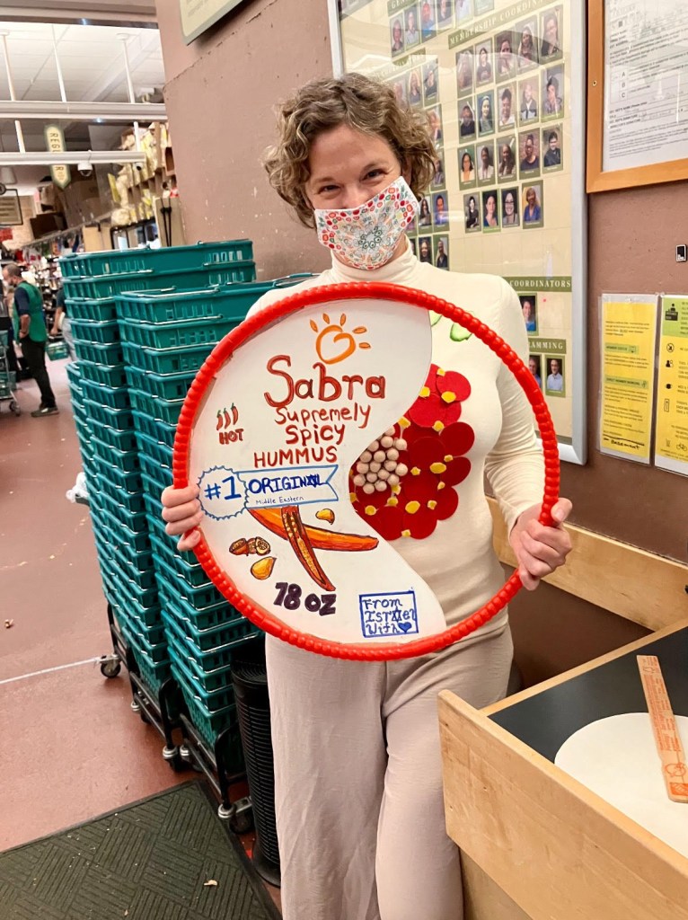 Zara Watkins, a co-op member who opposes the BDS movement, said she was menaced and cursed at last Halloween for wearing a costume paying tribute to the Israeli-made product Sabra hummus.