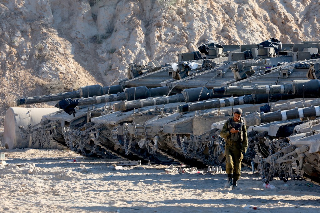 Israeli army tanks take position at the border between Israel and the Gaza Strip on May 29, 2025, amid the ongoing war between Israel and Palestinian militant movement Hamas. (Photo by Jack GUEZ / AFP) (Photo by JACK GUEZ/AFP via Getty Images)