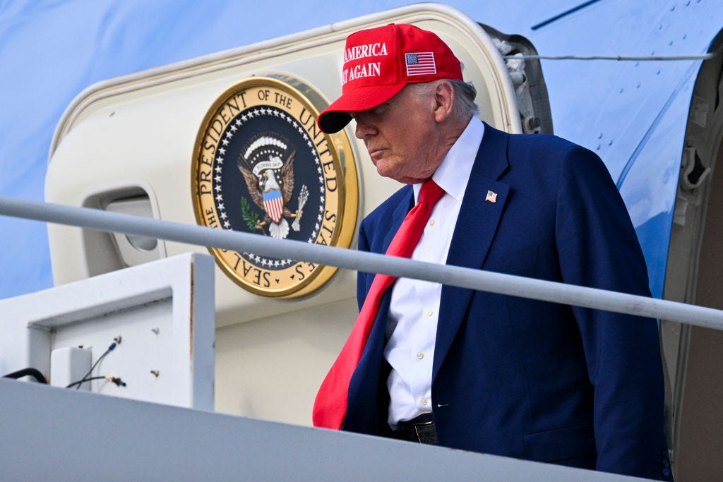 US President Donald Trump steps off Air Force One