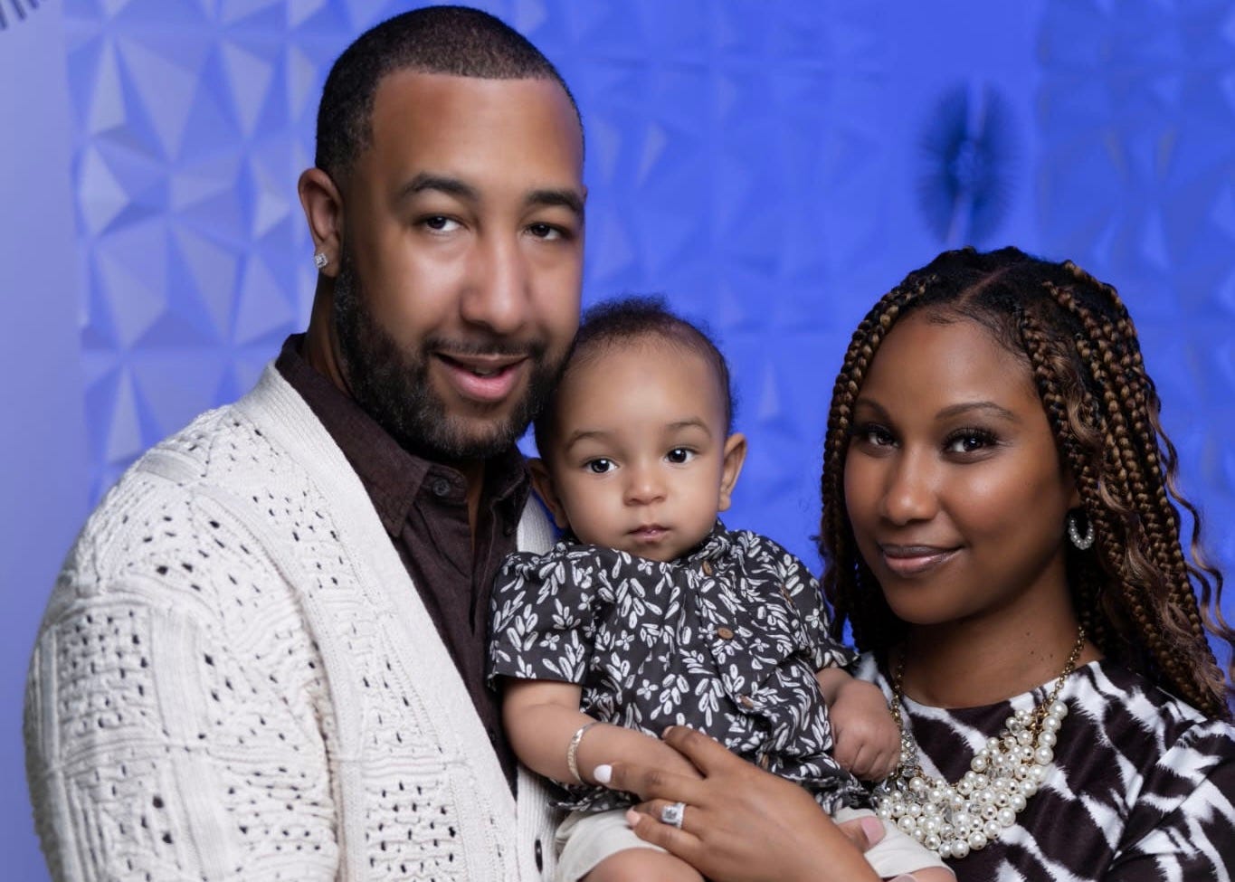 Shiraine and Barrett McLeod hold their young son, Lejend.