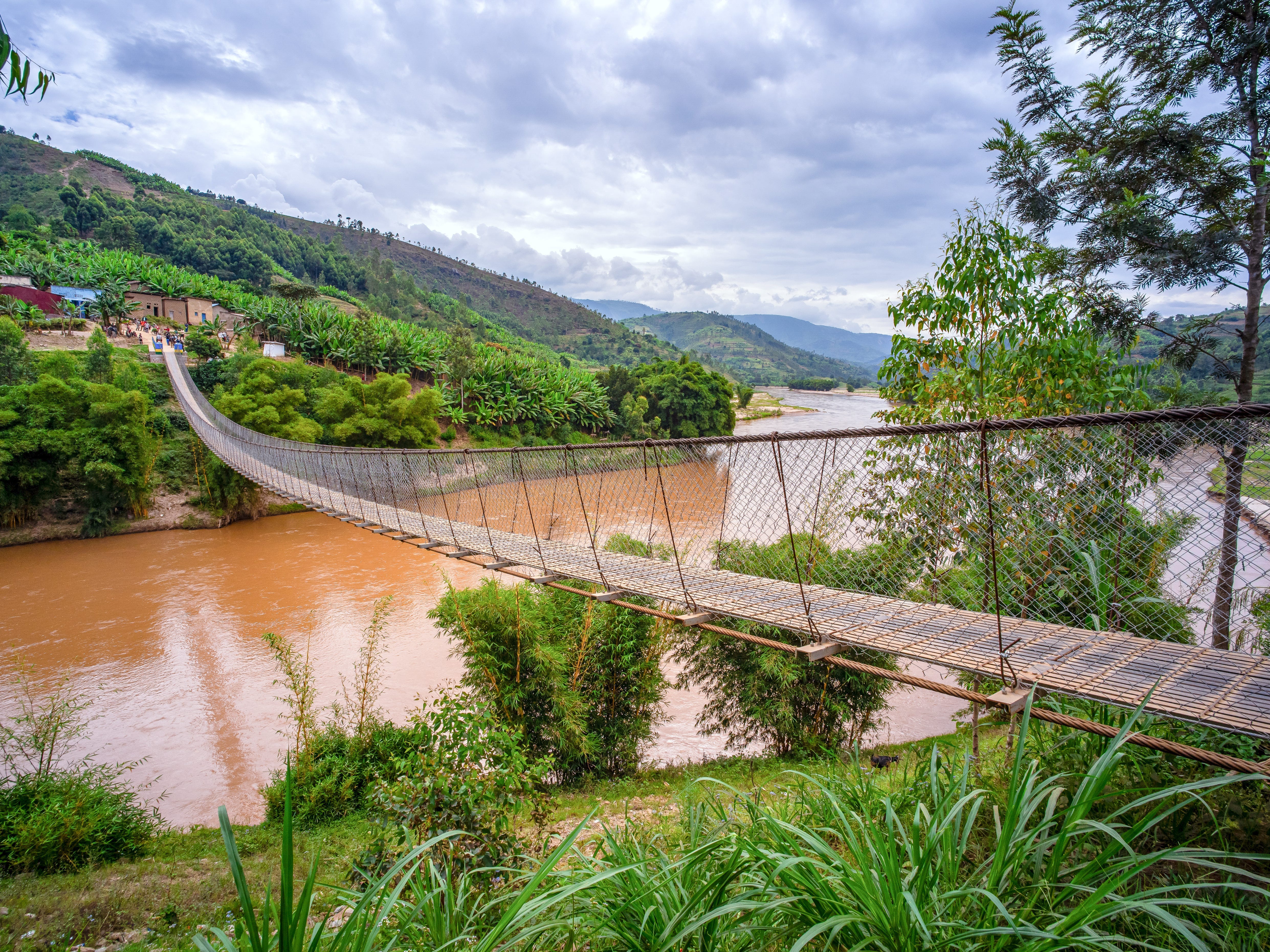 A bridge over a large waterway leading to a village in Gahira, Rwanda.
