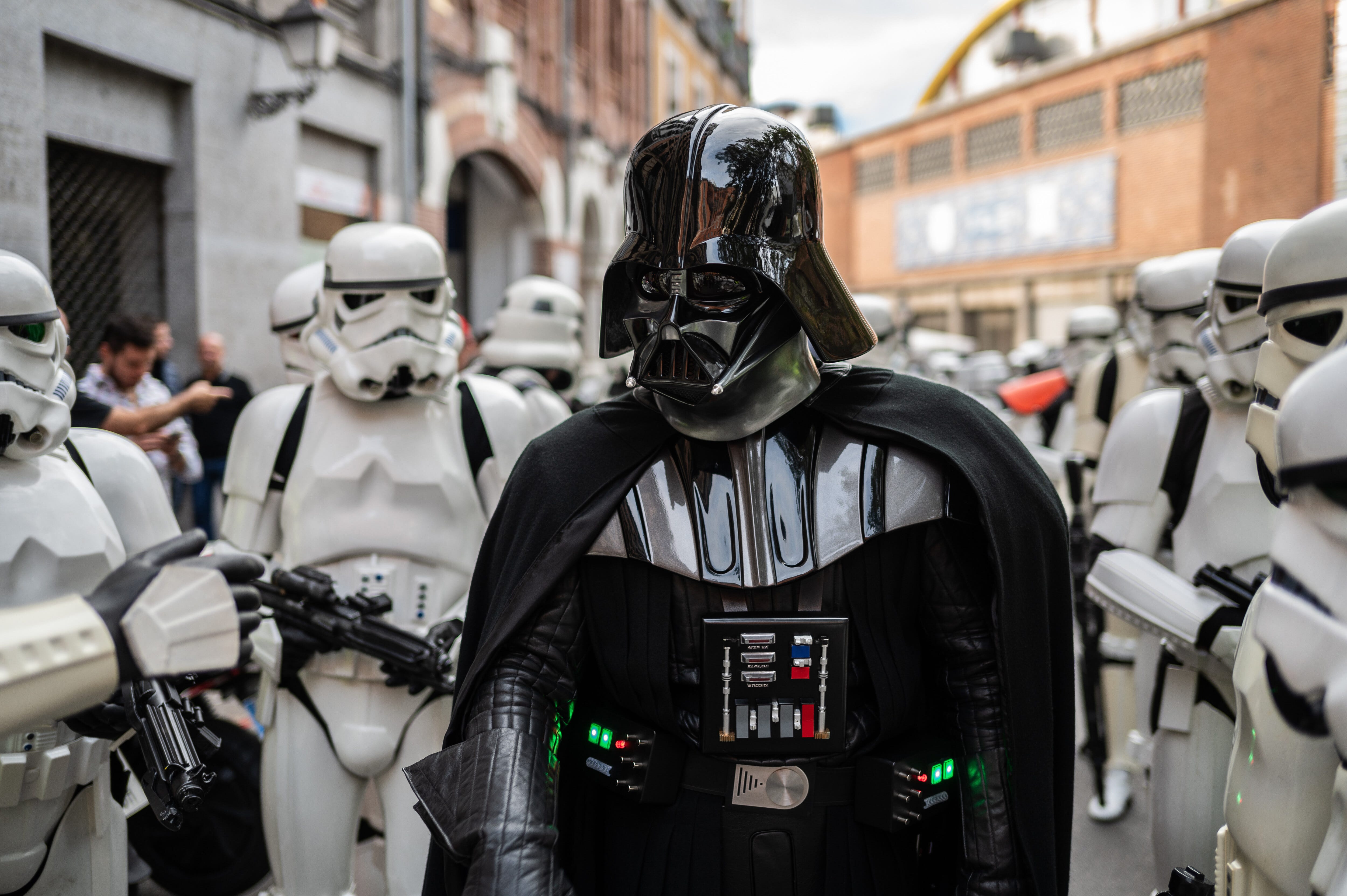 a man dressed in a darth vader costume
